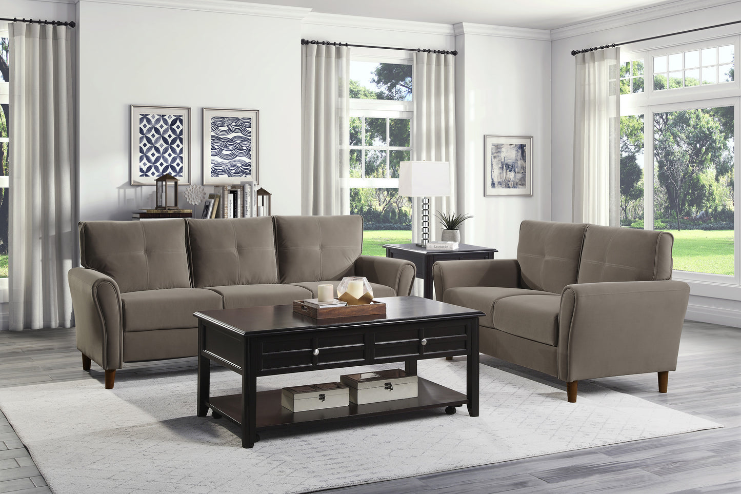 Taupe fabric threeseater sofa with tufted back cushions and rolled arms