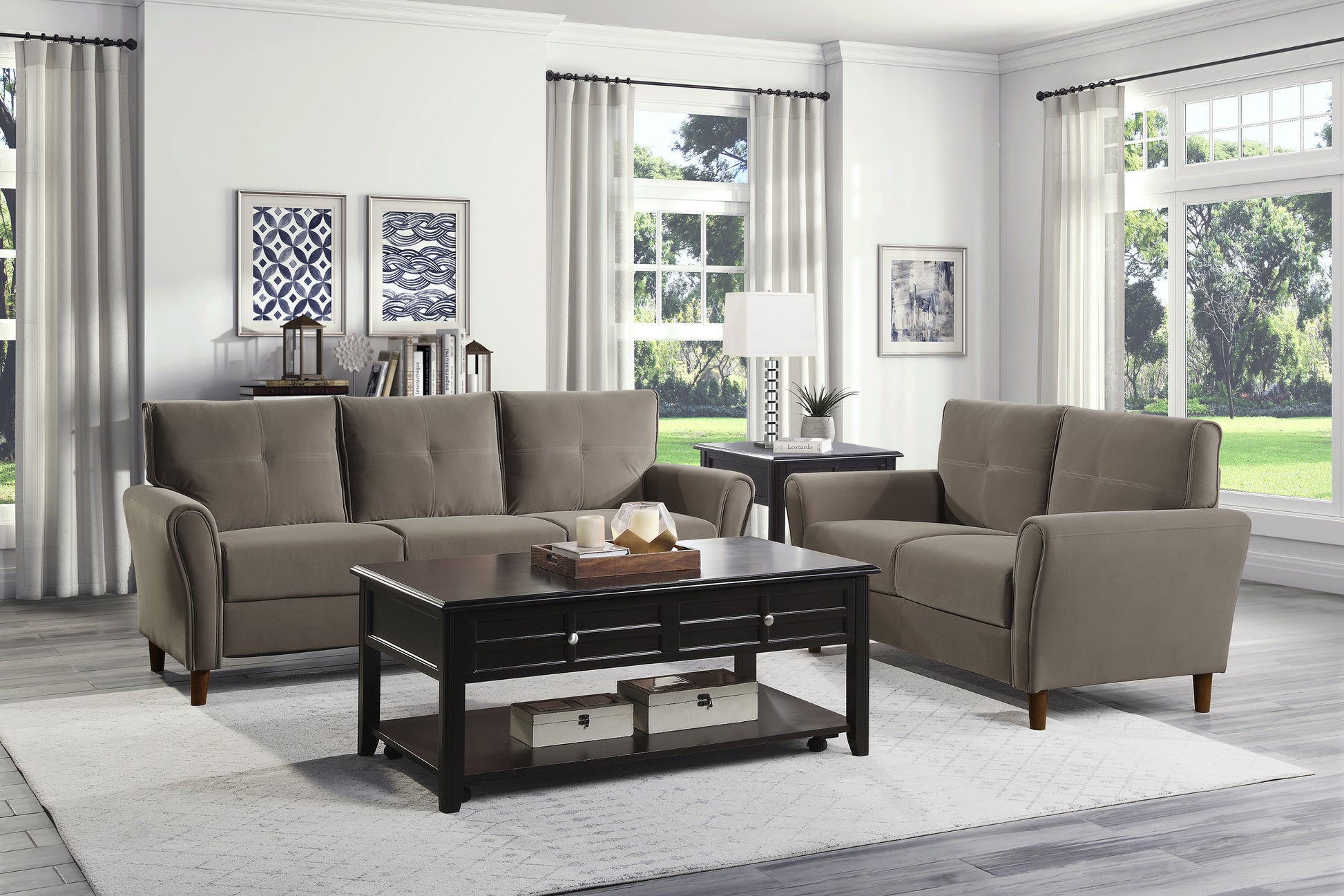 Taupe fabric threeseater sofa with tufted back cushions and rolled arms