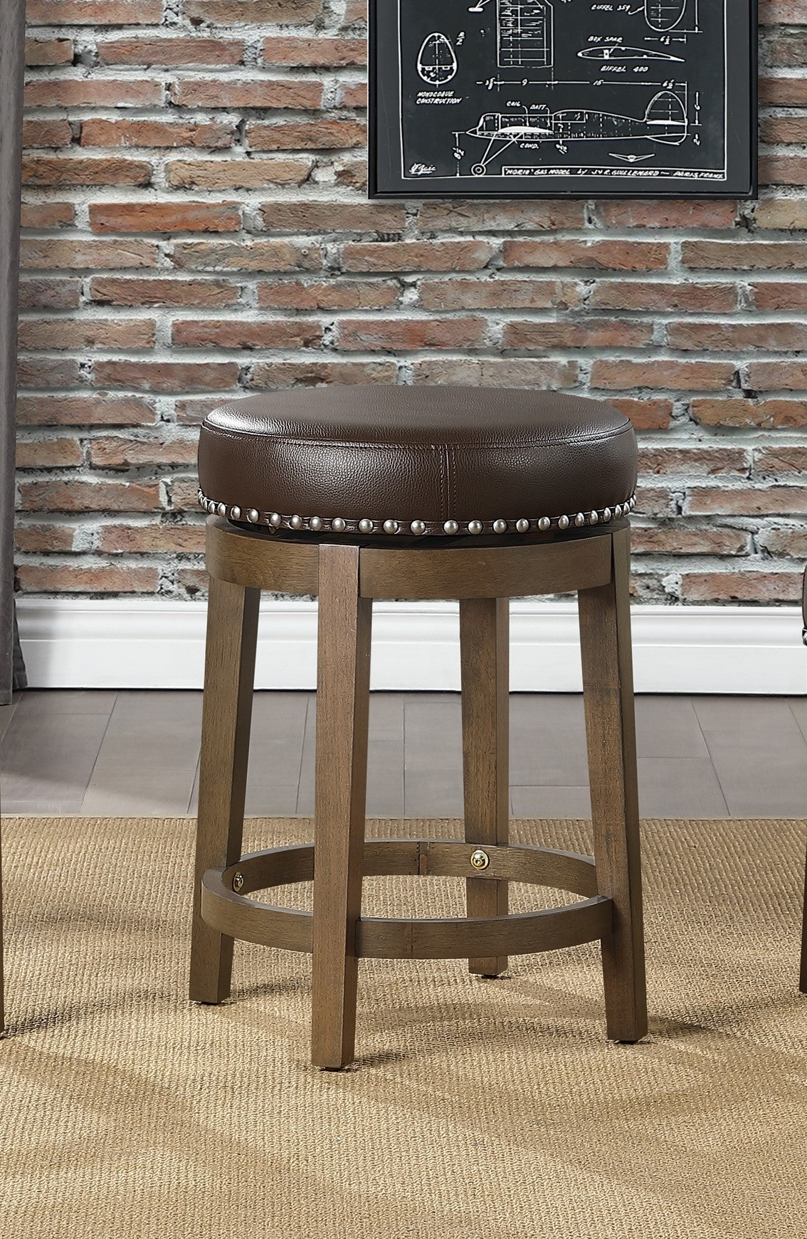 Brown leather swivel bar stool with nailhead trim and wooden legs