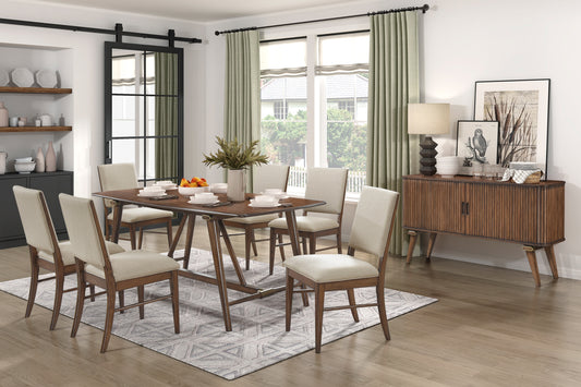 Wooden dining table set with upholstered chairs and a geometric rug