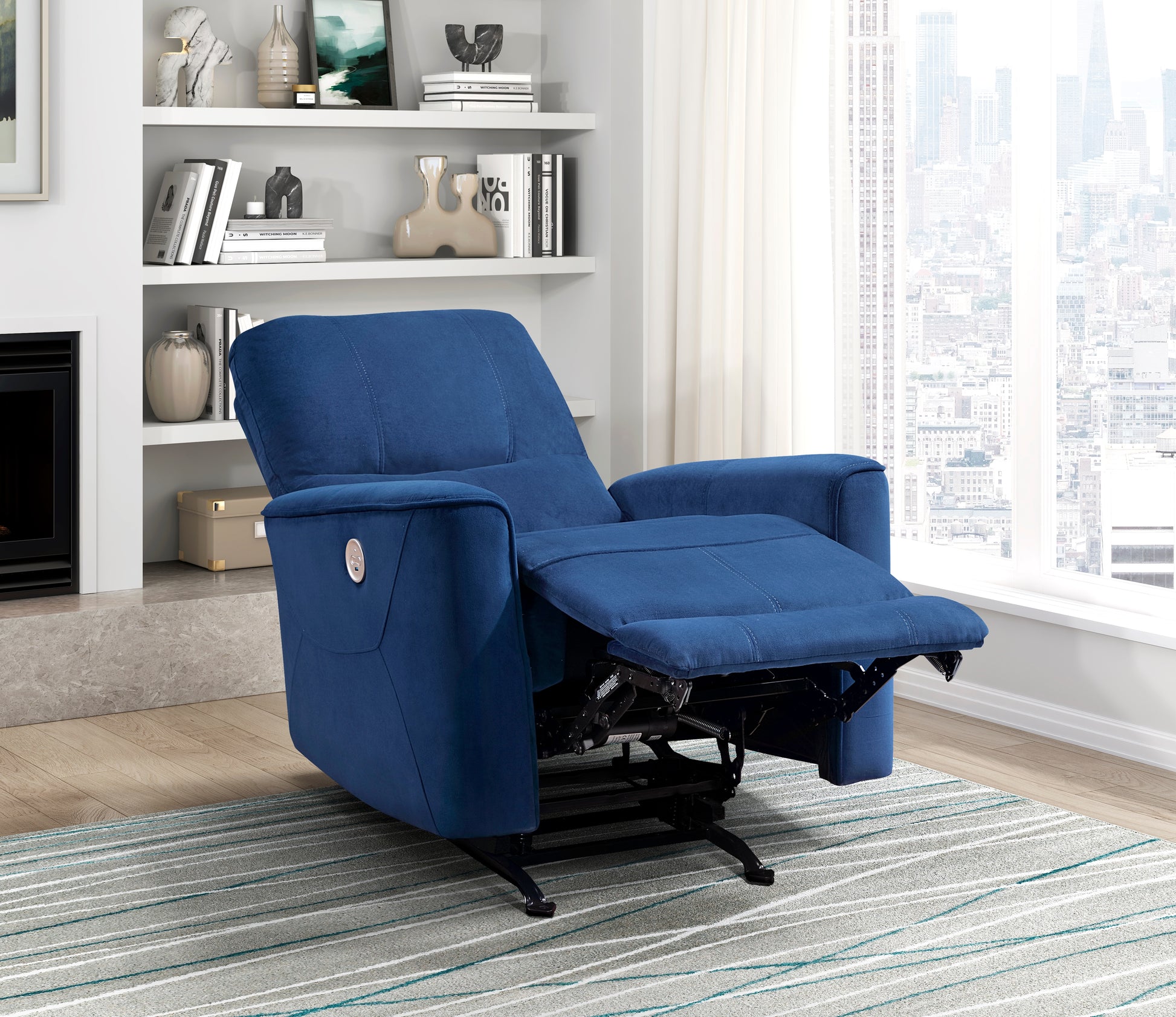 Deep blue velvet power recliner with chrome button and extended footrest