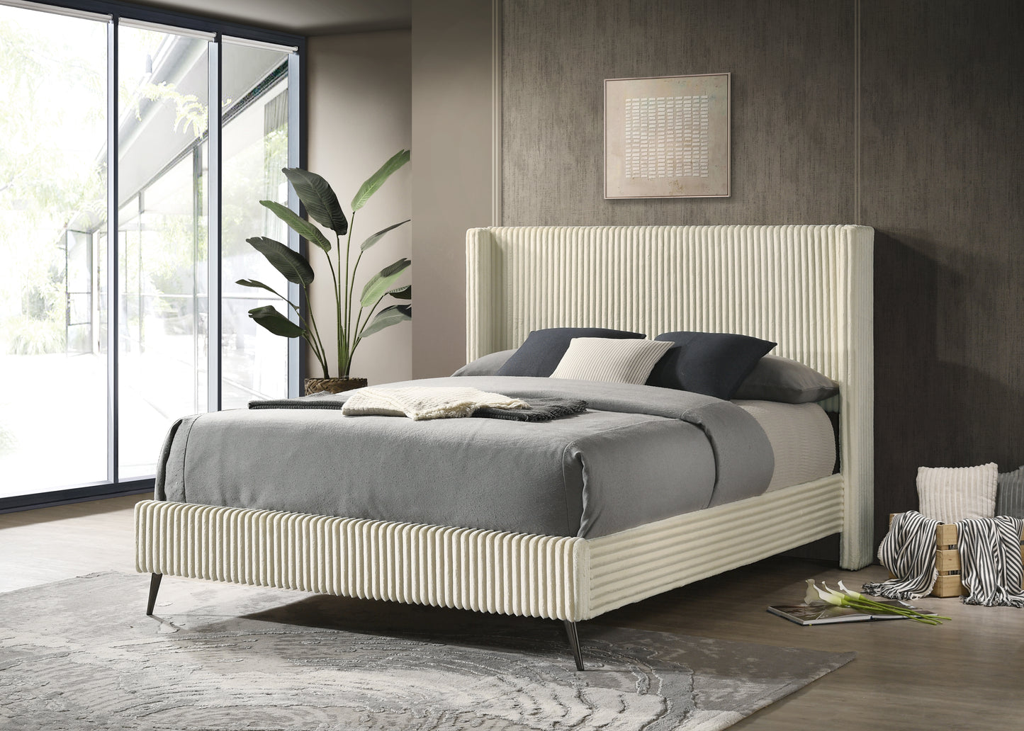 Cream upholstered platform bed with textured headboard and footboard