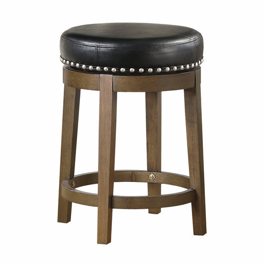 Black leather swivel bar stool with studded trim and a dark wood base