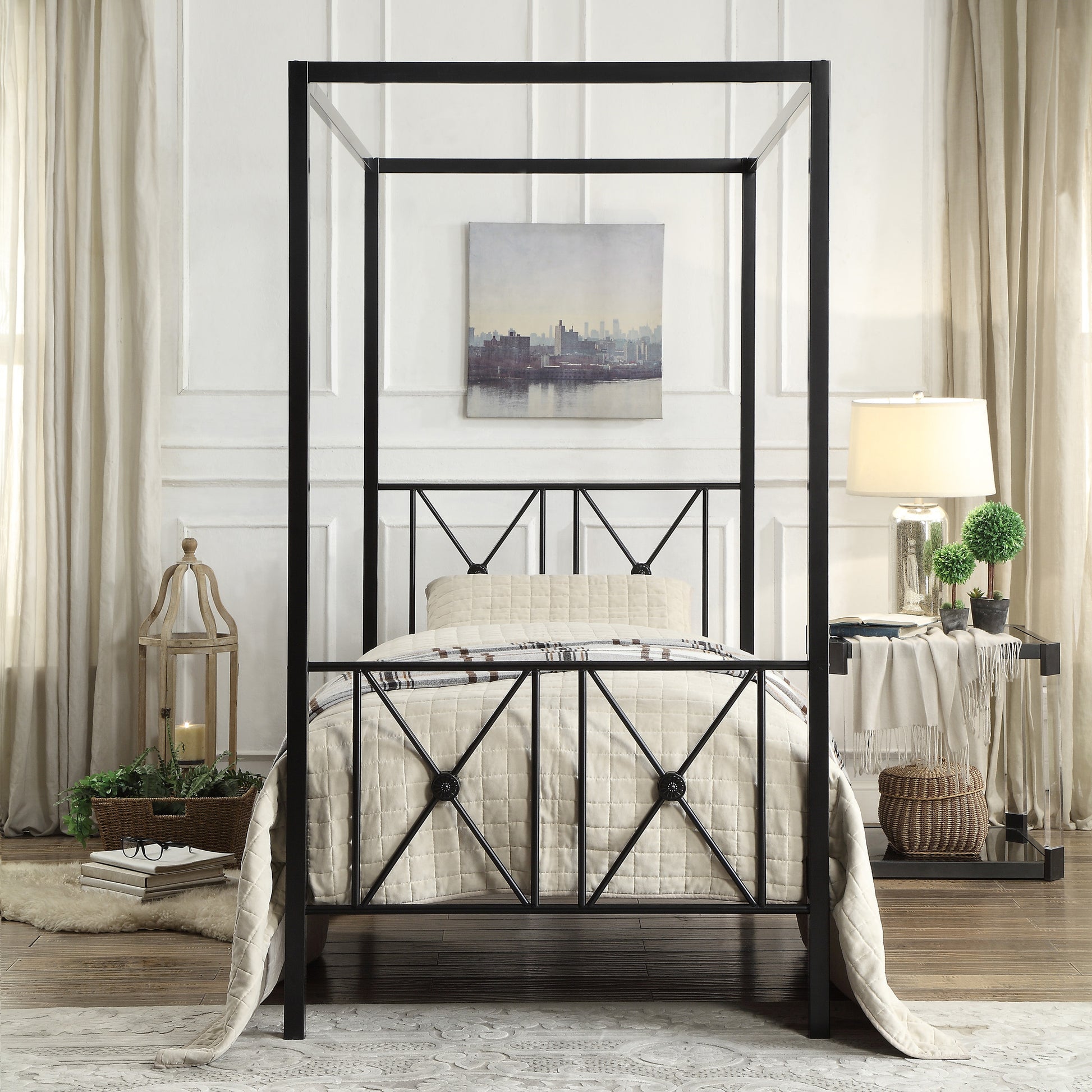 Black metal canopy bed frame with diamond pattern headboard and footboard