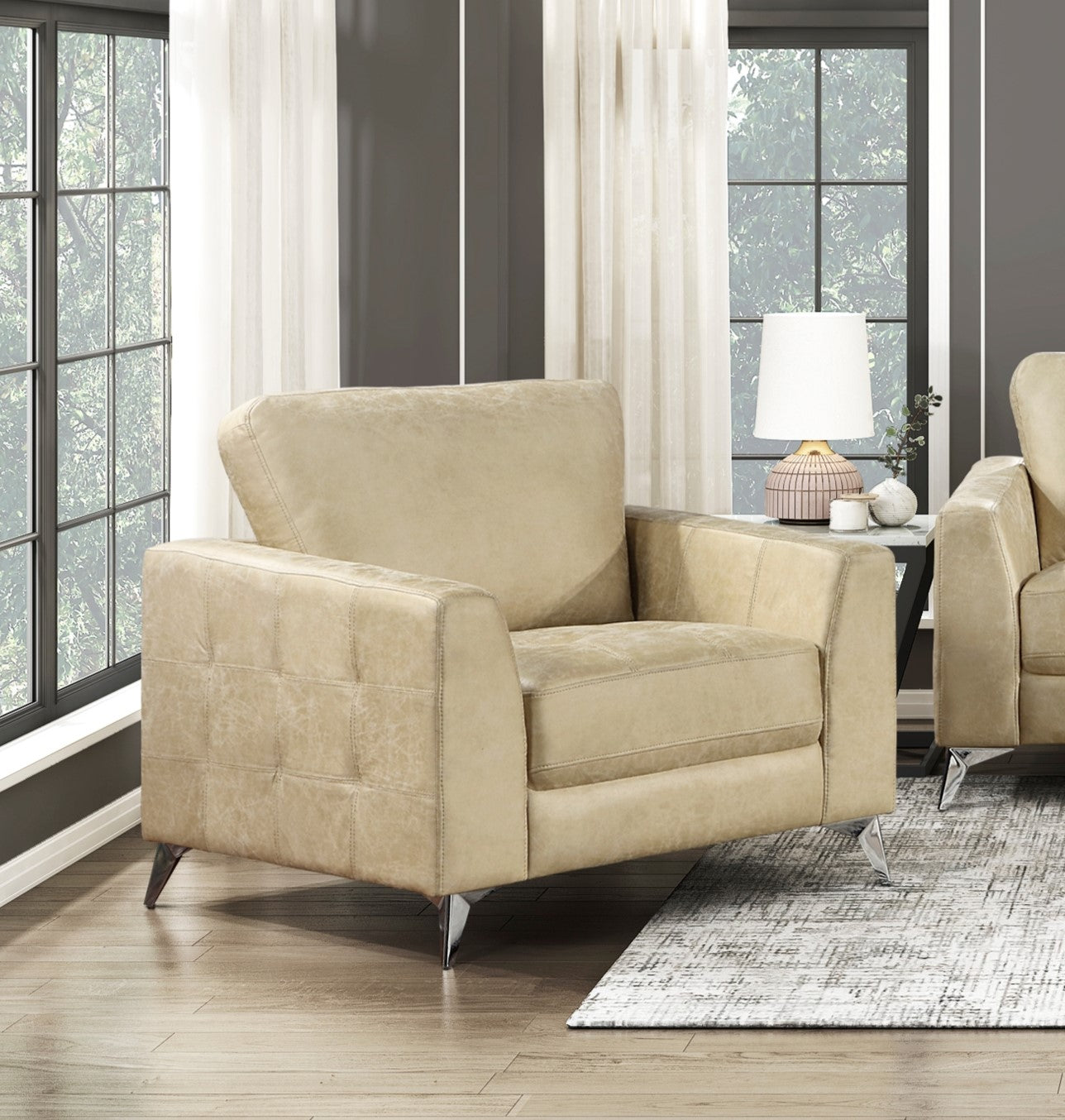 Beige leather armchair with quilted armrests and chrome legs