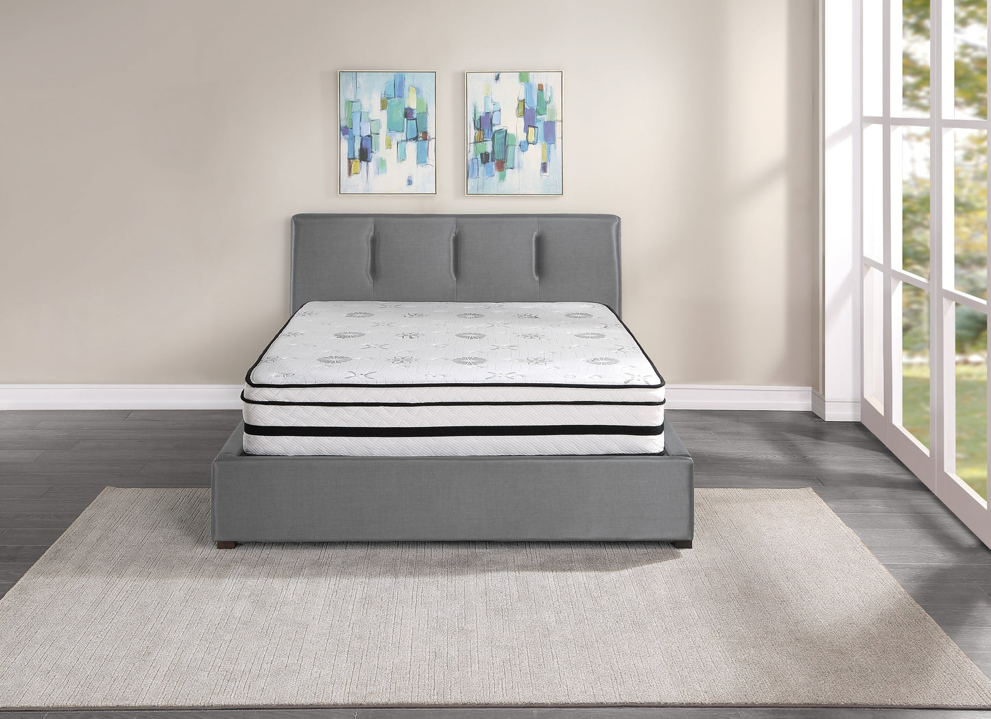 Plush white queen mattress with floral pattern and black trim on a grey bed frame