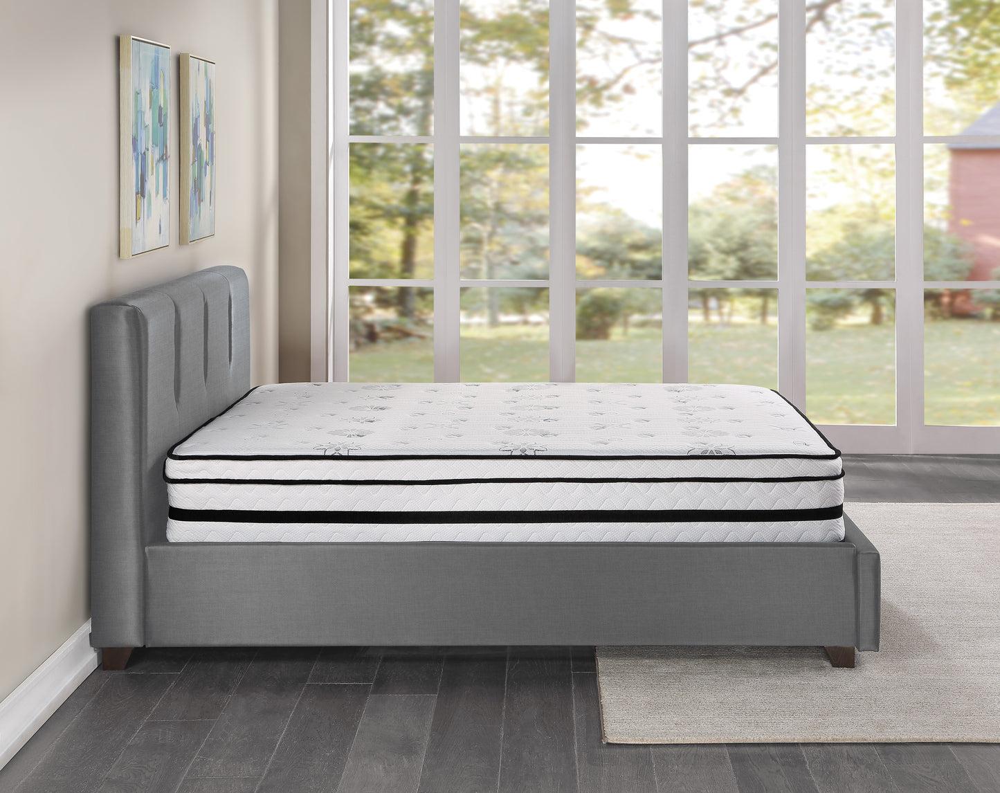 Plush upholstered grey bed frame with tufted headboard and a white hybrid mattress