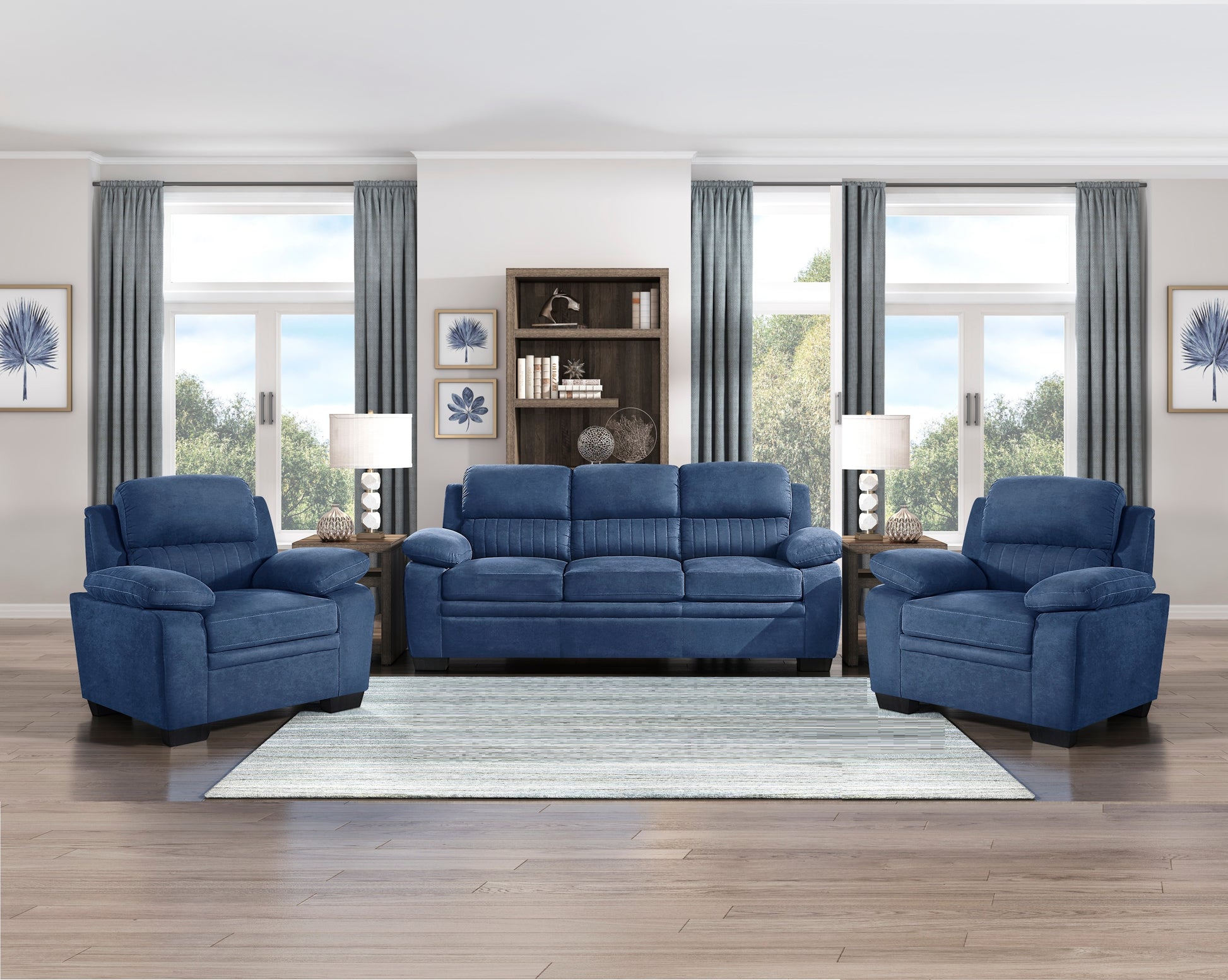 Navy blue plush reclining sofa with a channeled back and padded arms perfect for living rooms