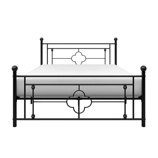 Black metal bed frame with decorative clover accents and spherical finials featuring a white mattress