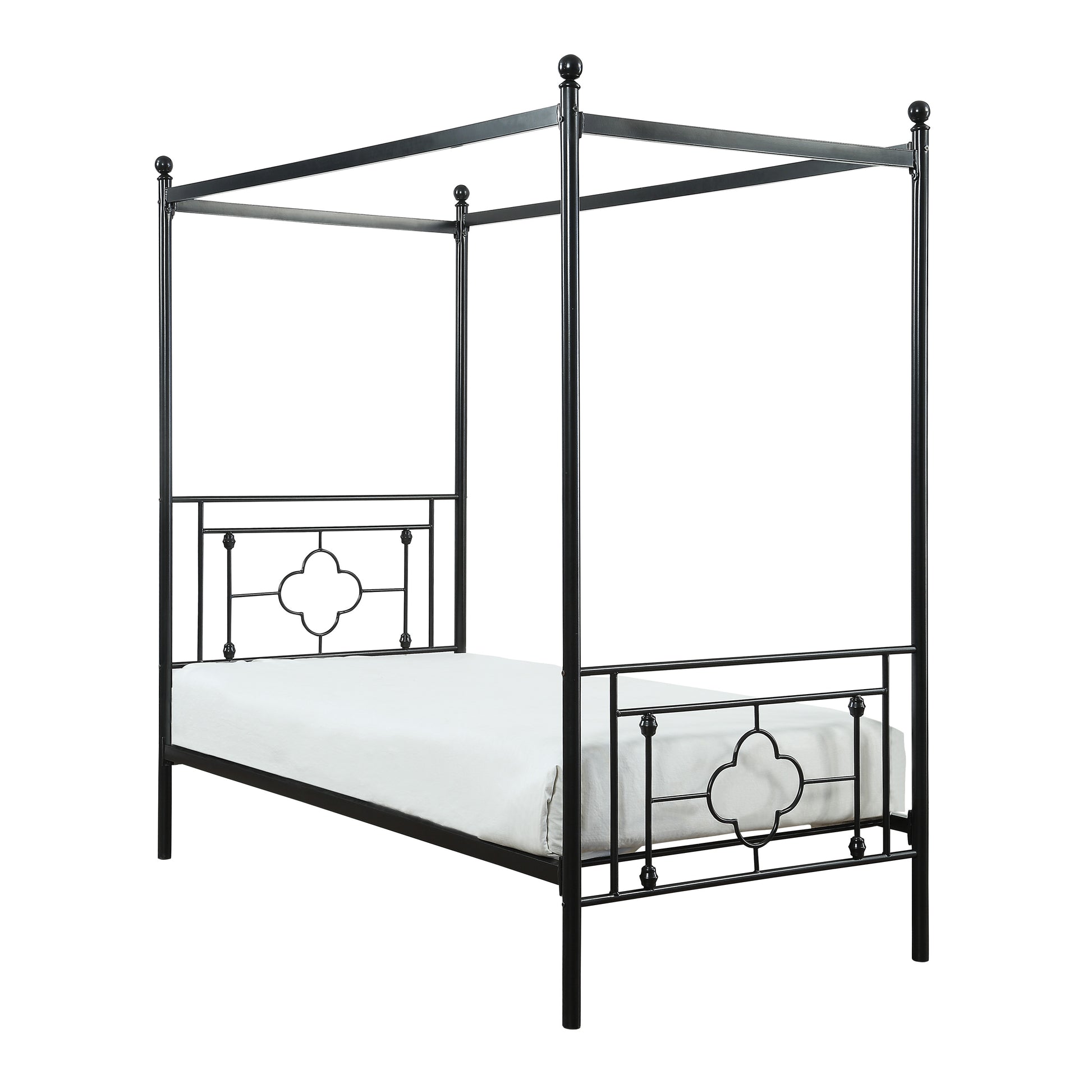 Black metal four poster bed frame with decorative clover details and white mattress