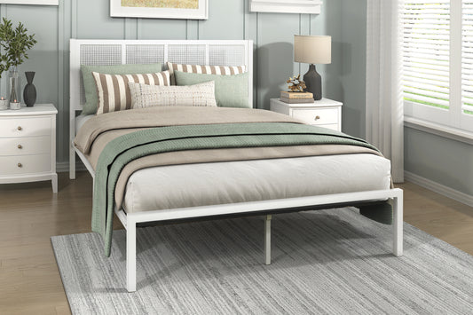 White metal cane headboard bed frame with plush bedding and sage green accents