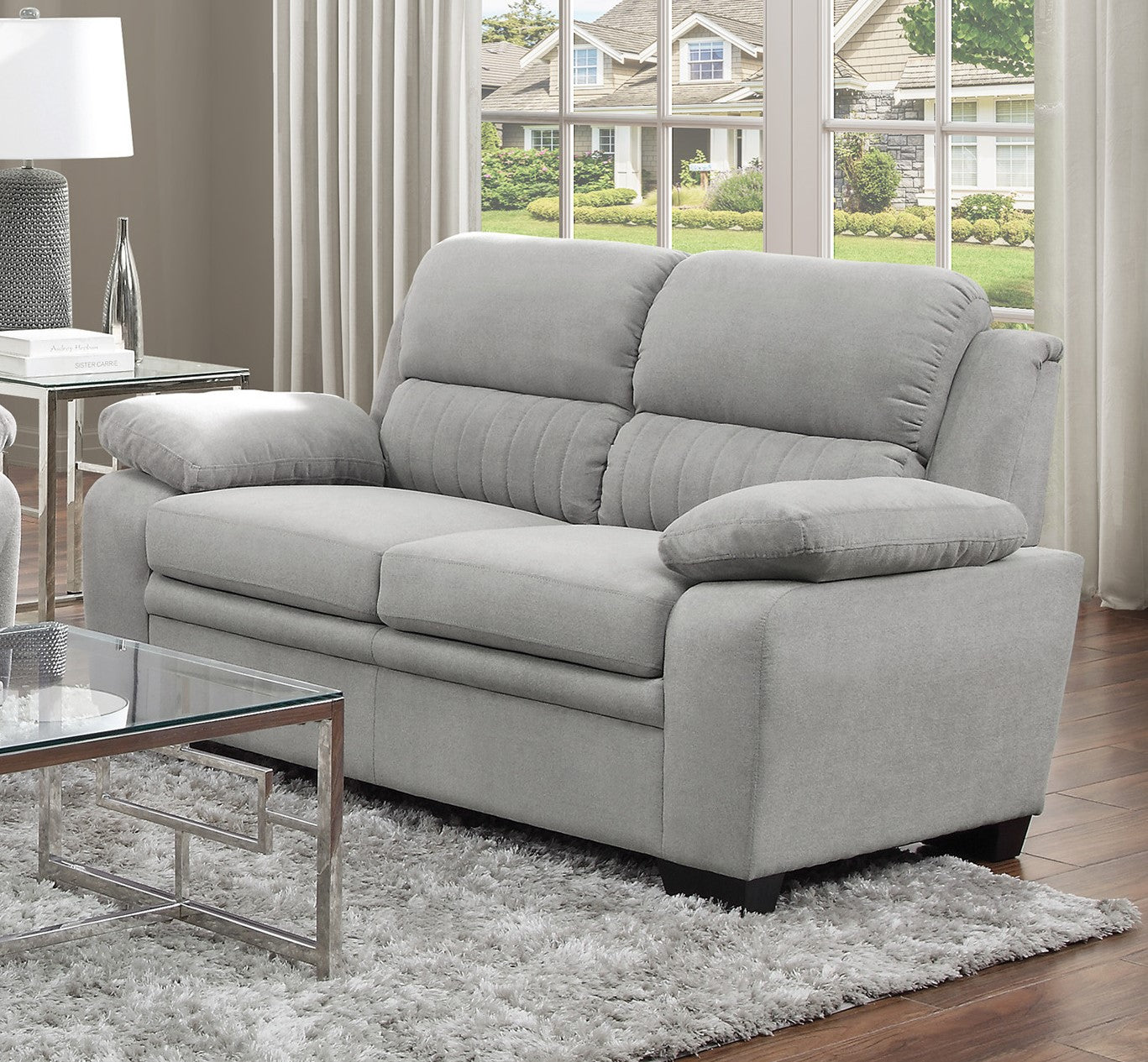 Soft grey fabric loveseat with plush cushions modern accent stitching on backrest