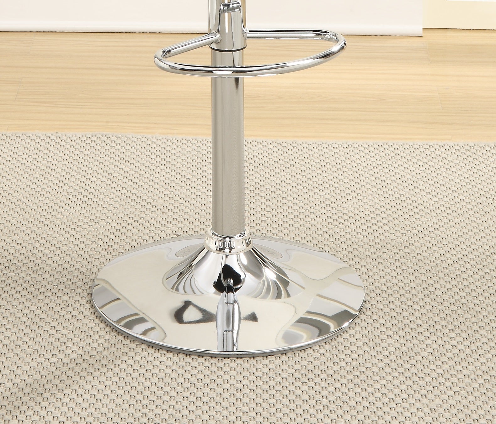 Polished chrome bar stool base with adjustable height mechanism and footrest ring