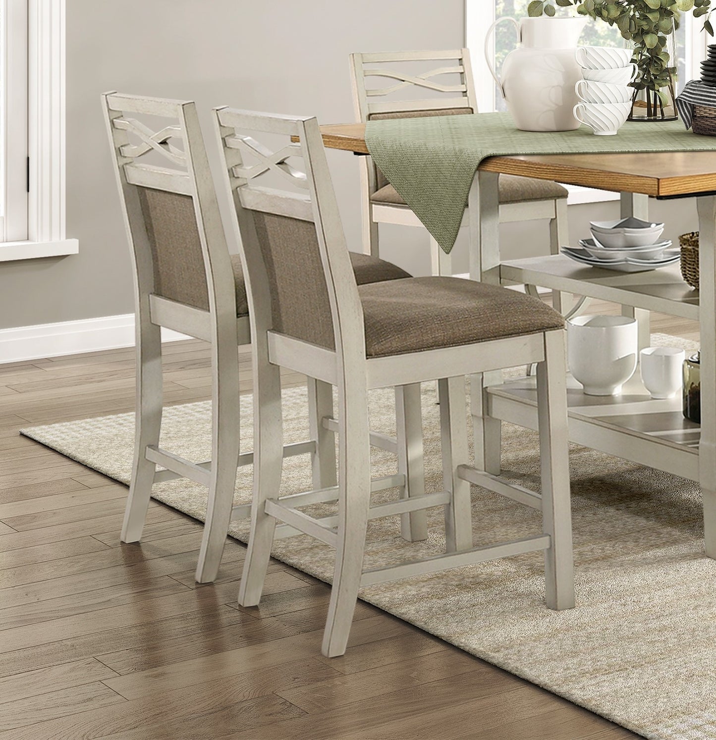 Pair of distressed white wooden bar stools with crisscross backrests and upholstered seats