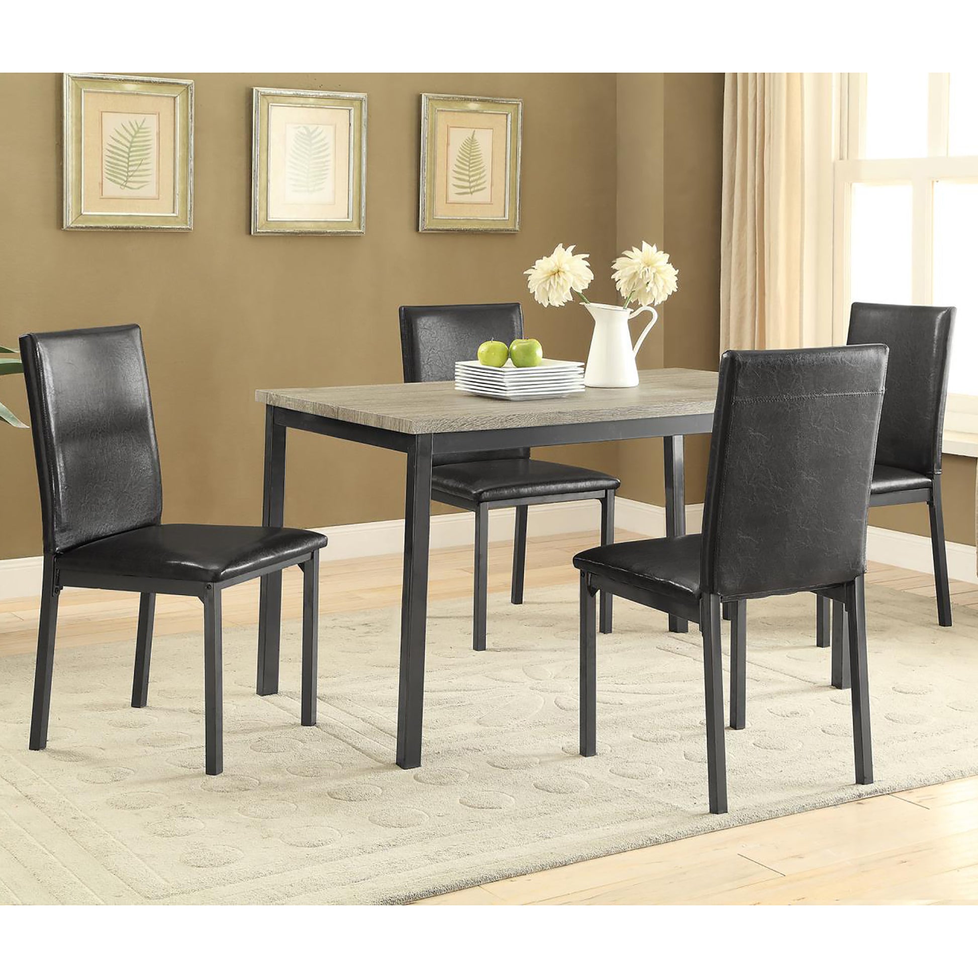 Modern dining set with four black faux leather chairs and a distressed wood tabletop