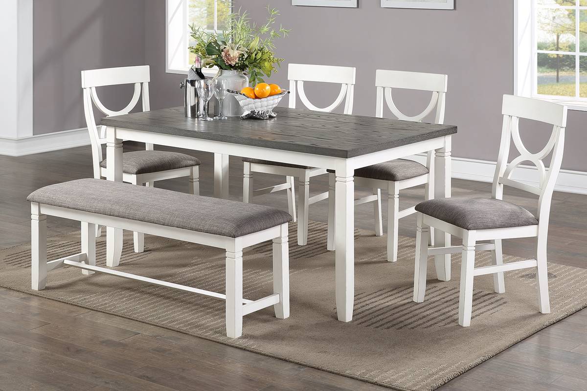 White and gray wood dining table with upholstered bench and chairs