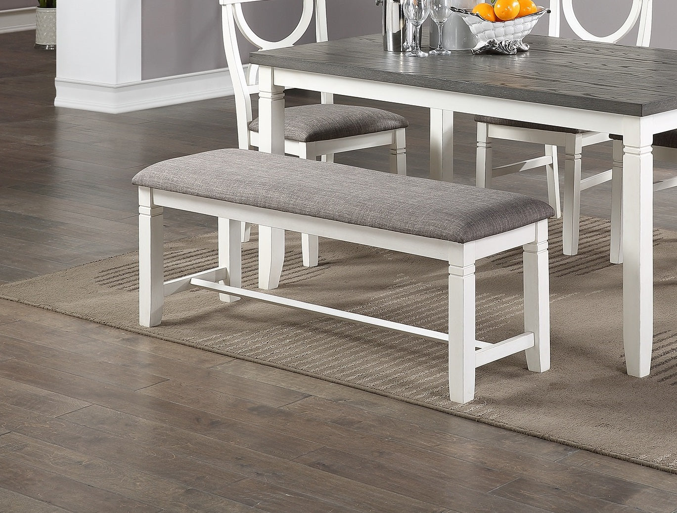 Whiteleg upholstered dining bench with gray fabric seat