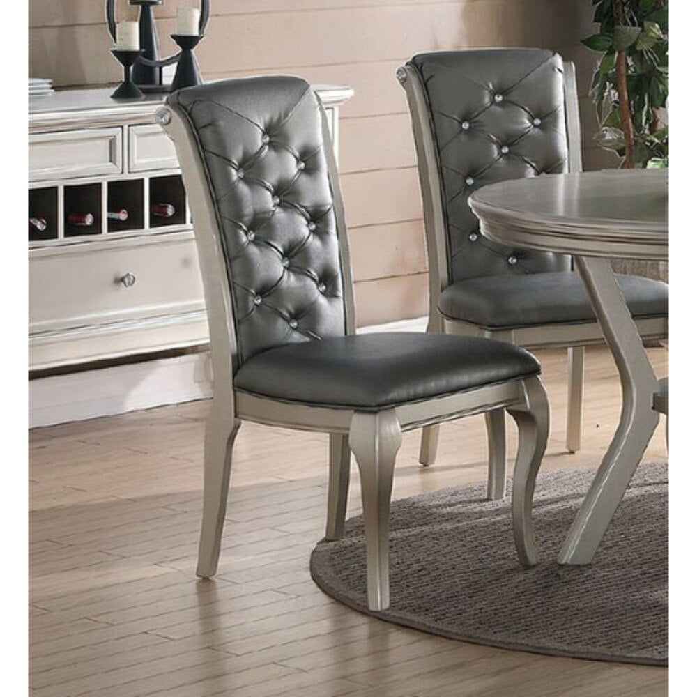 Elegant tufted gray dining chair with crystal accents and silver wood frame