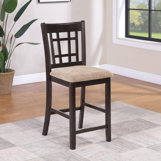 Dark wood counter stool with a geometric backrest and beige fabric seat