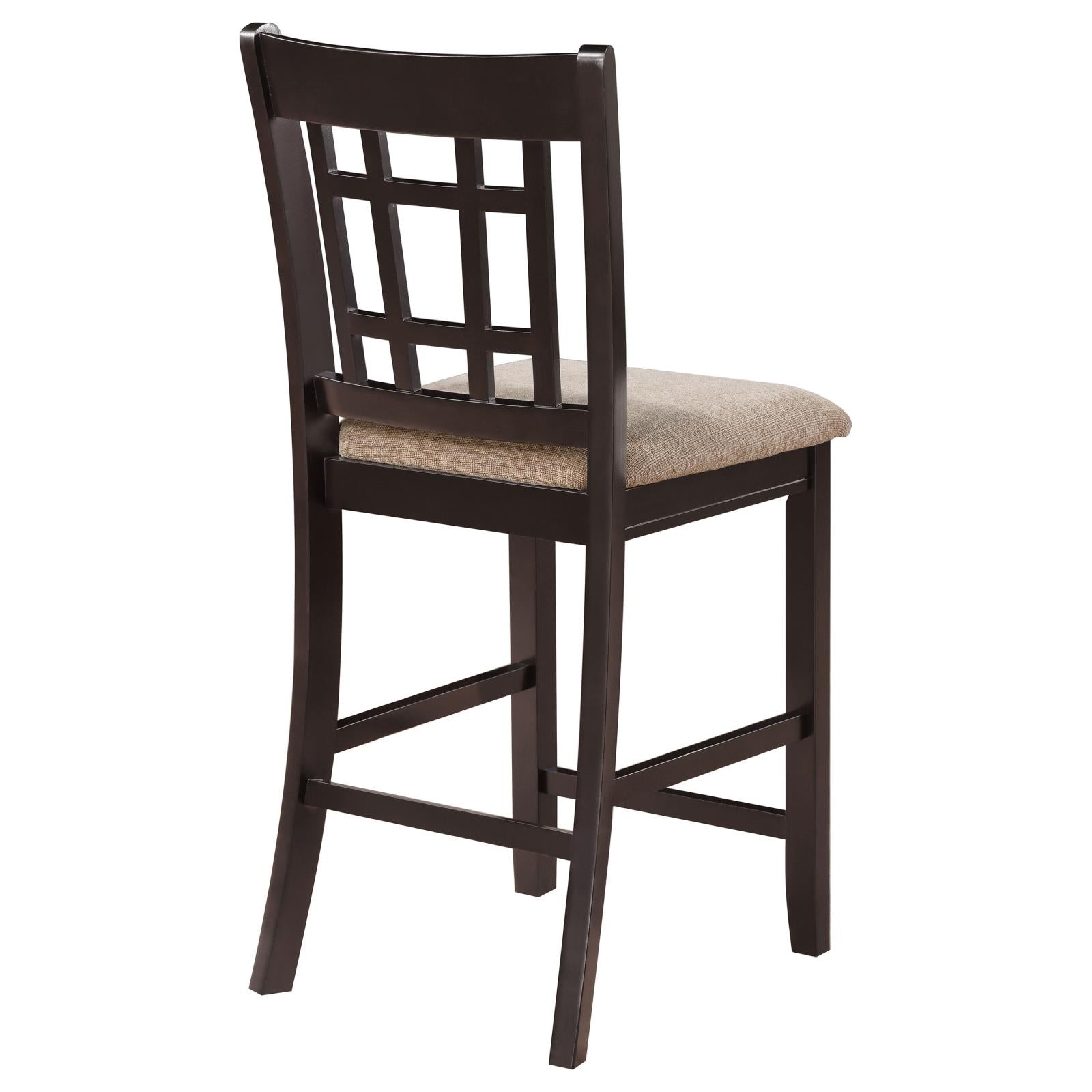 Dark brown wooden bar stool with geometric backrest and neutral fabric seat
