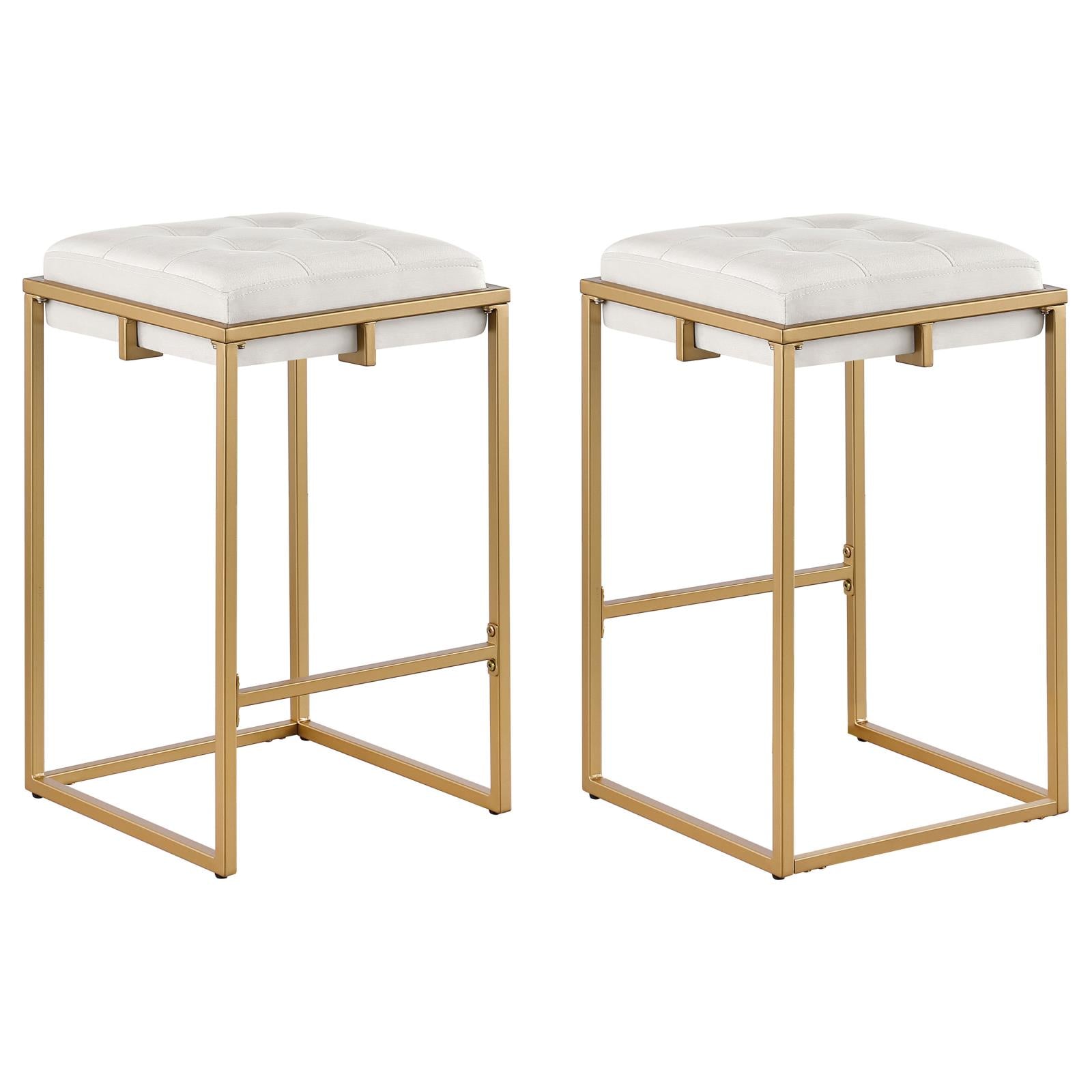 Two white tufted bar stools with gold metal frames