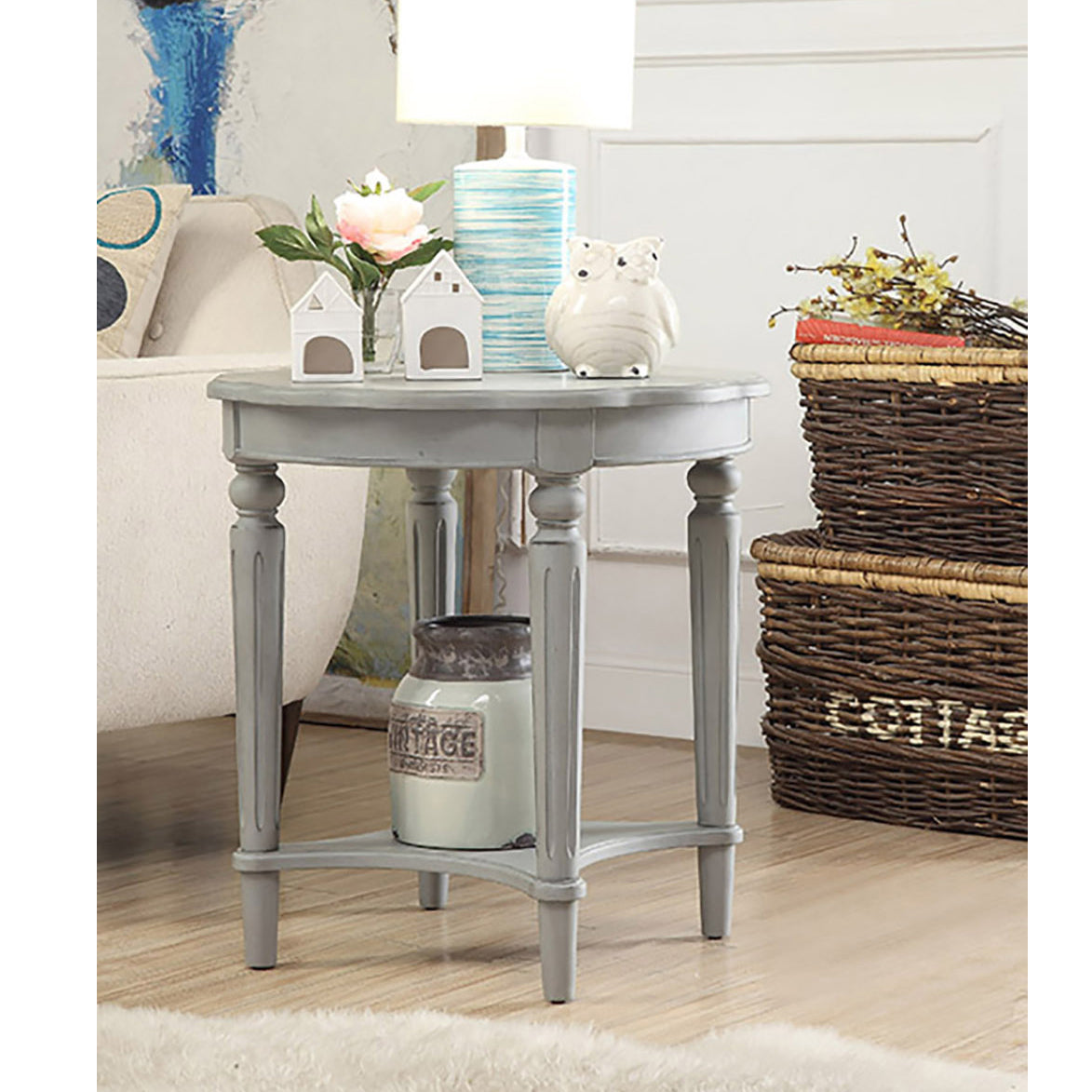 Distressed grey wood round end table with carved legs