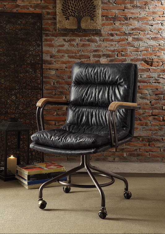 Black faux leather executive chair with padded seat and back brushed metal base with casters