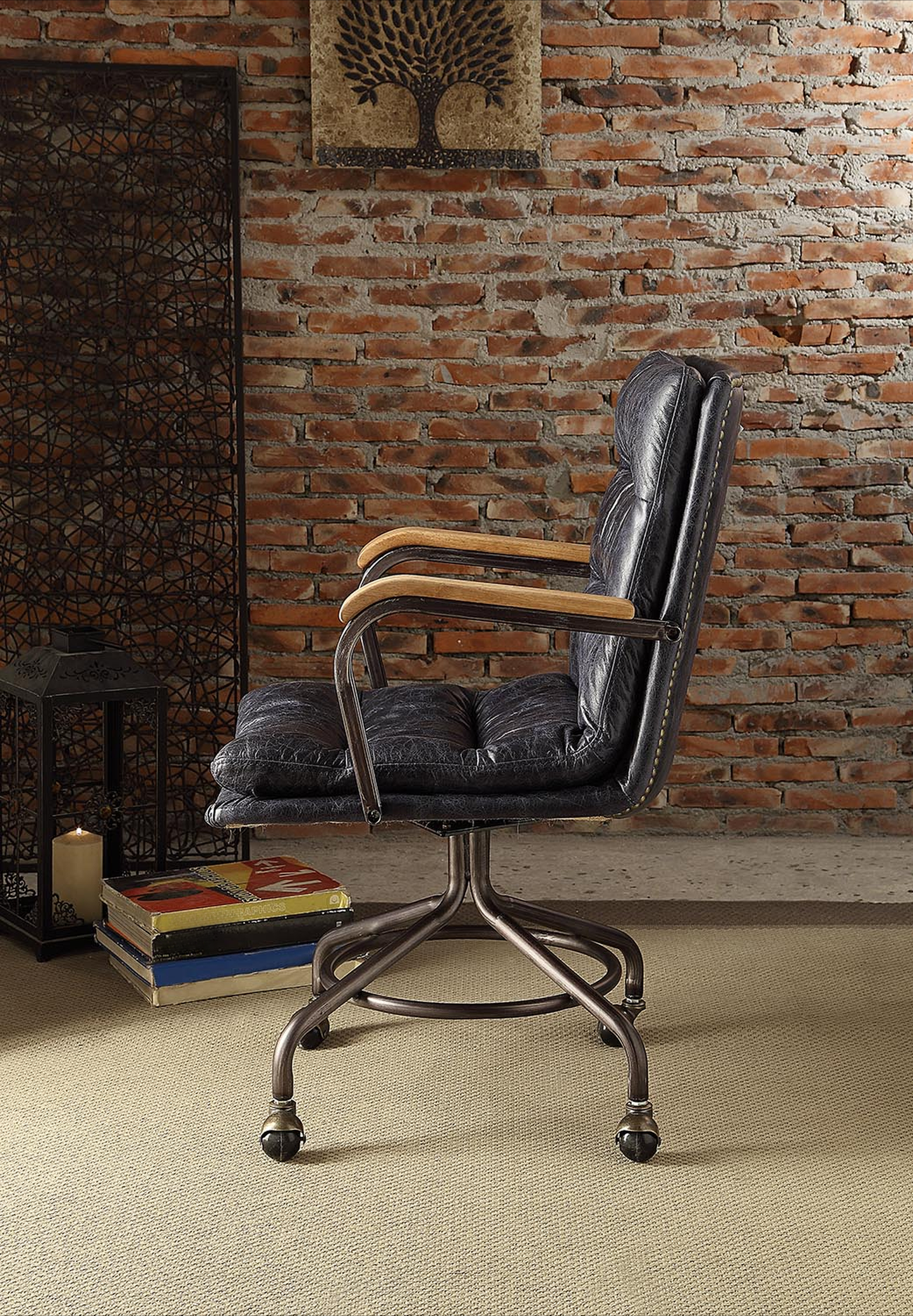 Dark blue tufted leather office chair with wood armrests and metal base