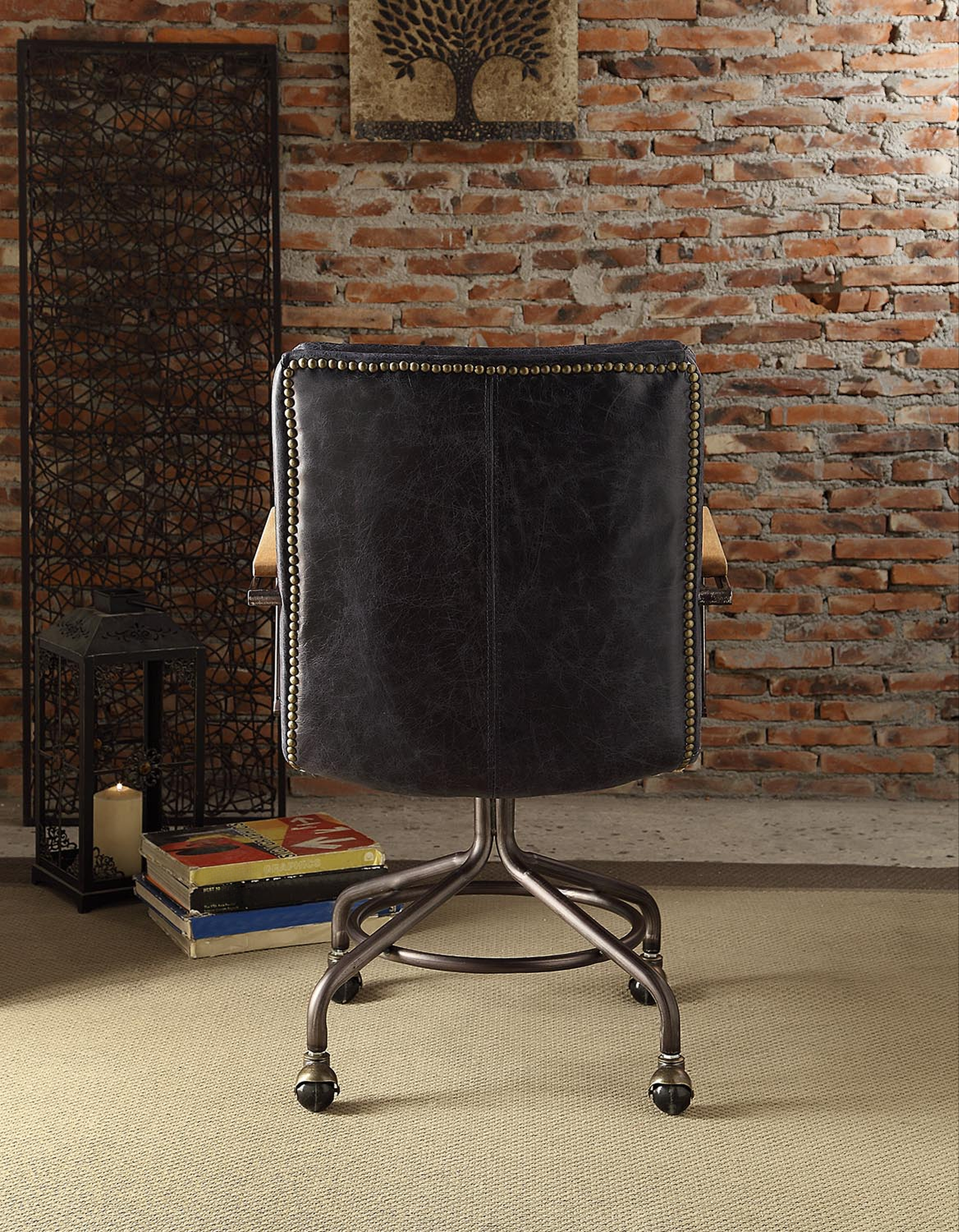 Dark brown leather office chair with brass nailhead trim and metal base