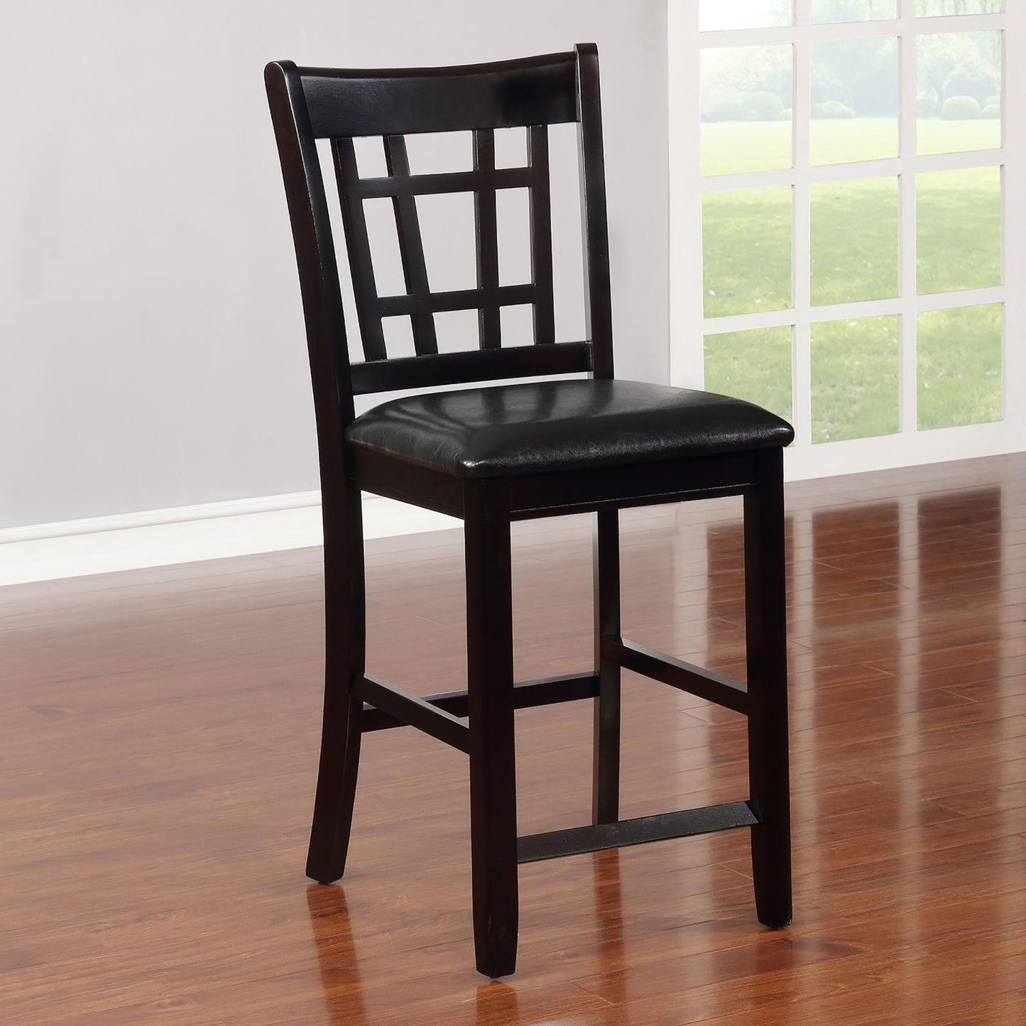 Dark wood bar stool with padded black seat and geometric backrest