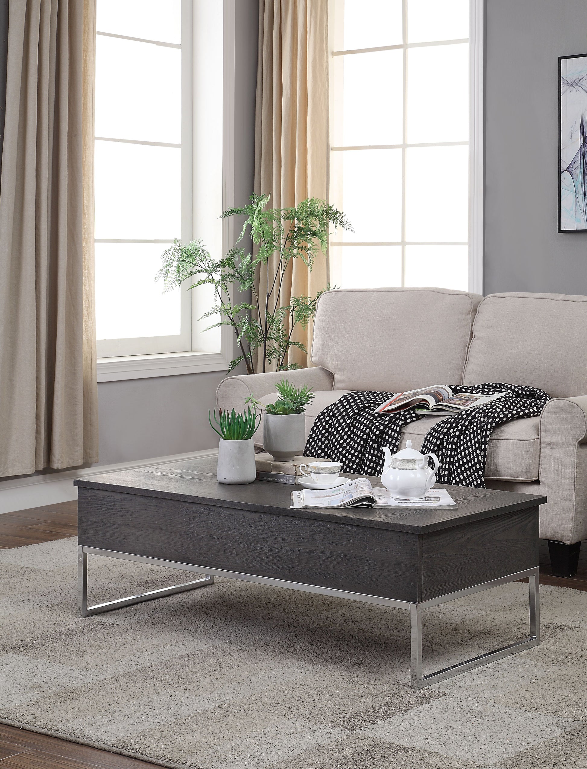 Dark wood lifttop coffee table with chrome legs ideal for modern living rooms