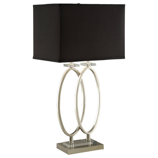 Sleek silver table lamp with a black rectangular shade and modern oval accents