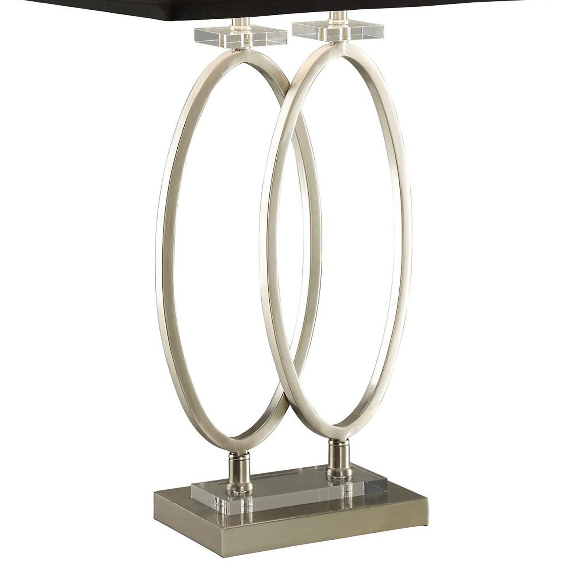 Modern silver lamp with interlocking oval design and clear acrylic accents