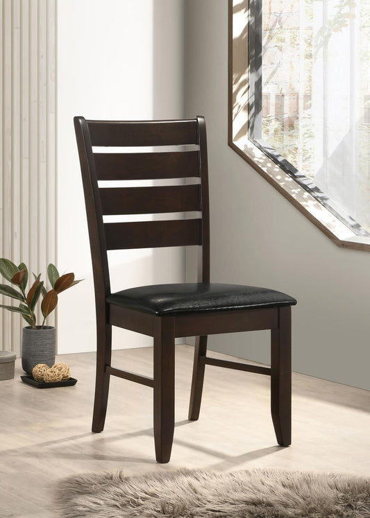 Dark wood dining chair with slatted back and black leather seat perfect for modern homes