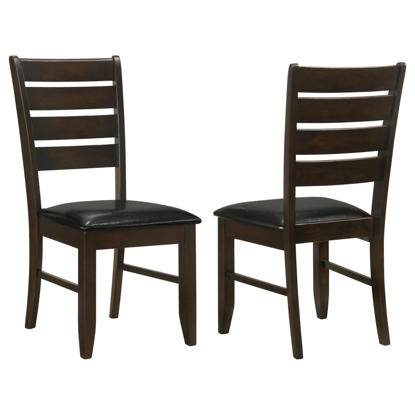 Two dark brown wooden dining chairs with black faux leather seats and ladder backs