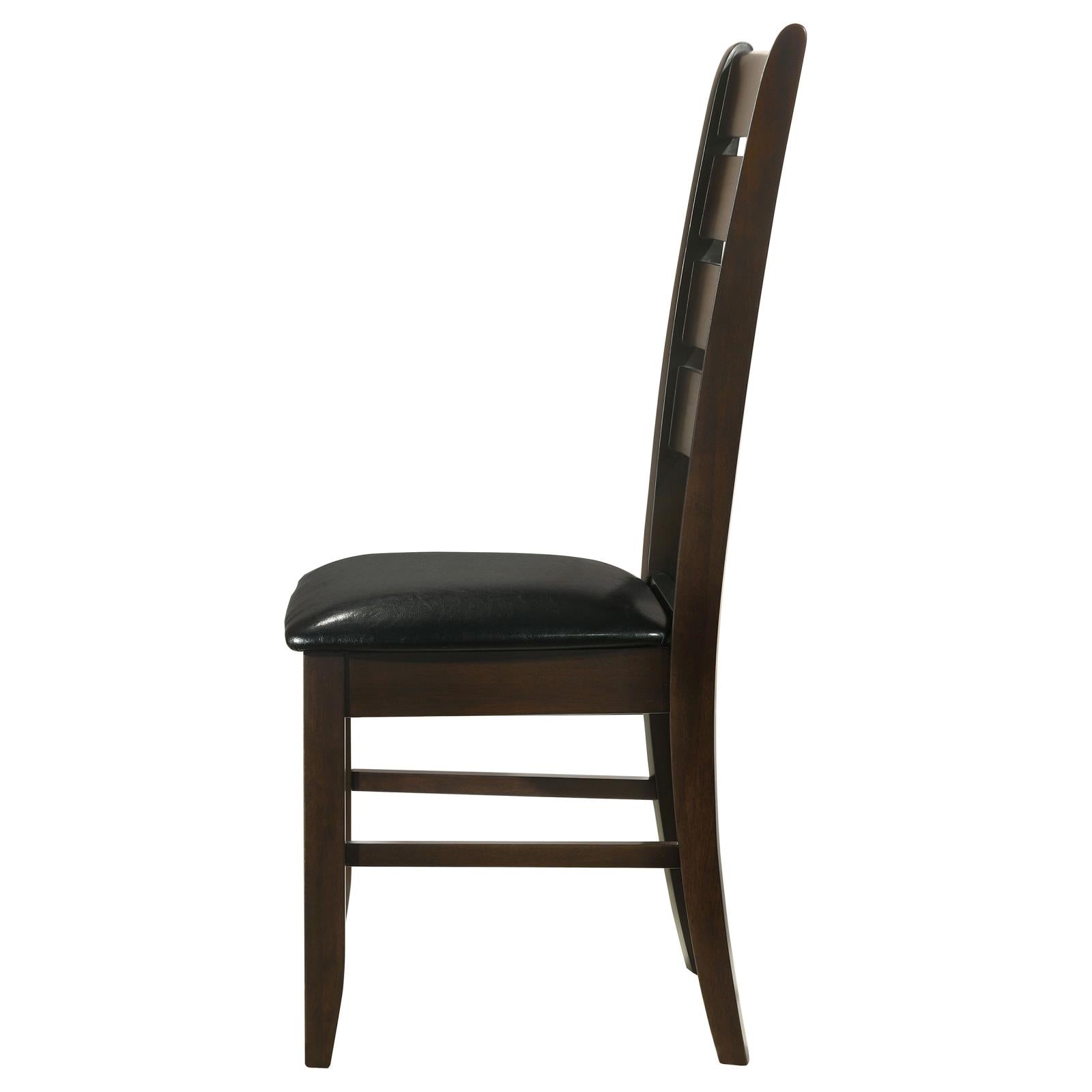 Dark wood dining chair with black leather seat and ladder back design