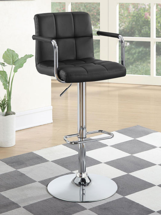 Black tufted leatherette bar stool with chrome base and armrests