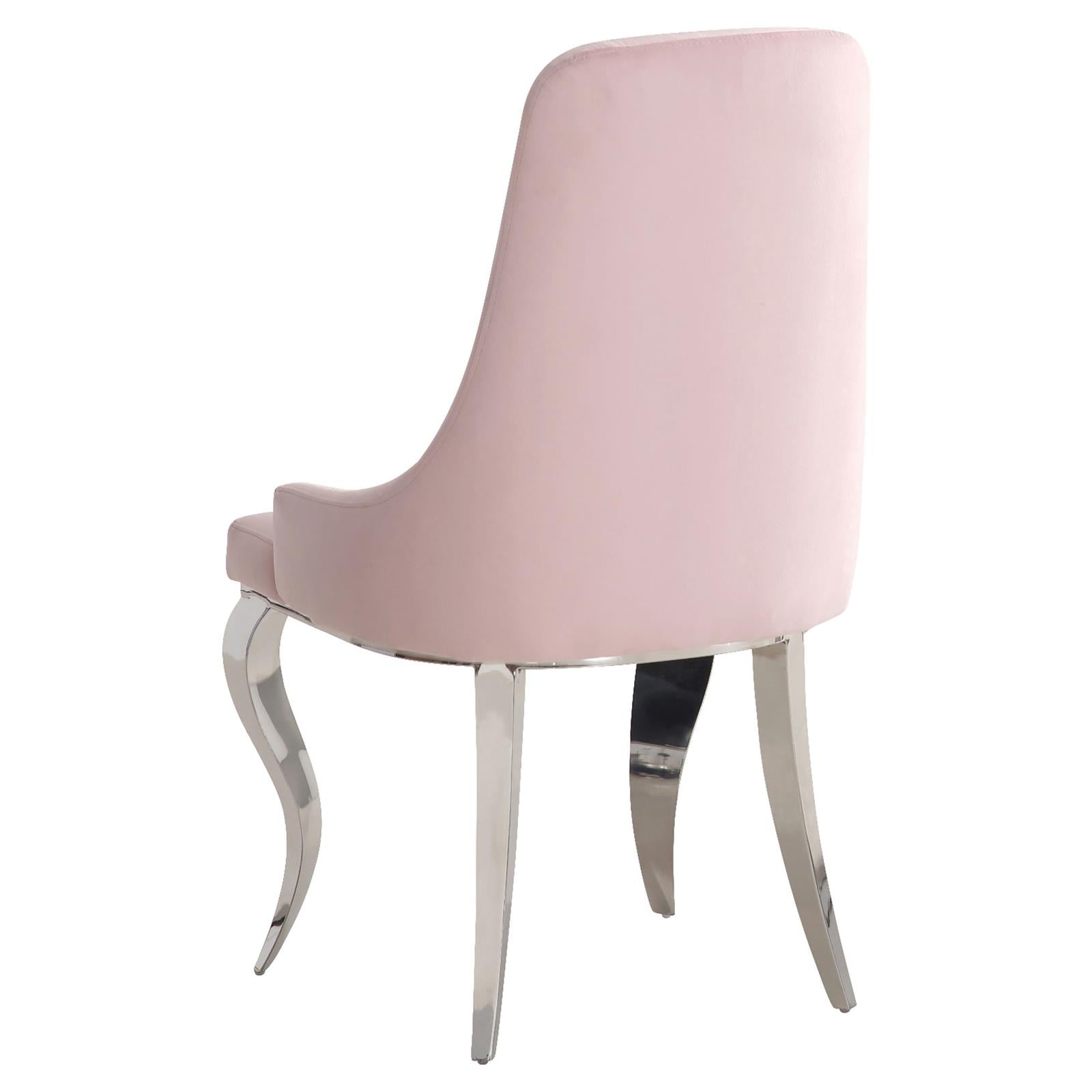 Pink velvet dining chair with tufted back and polished chrome legs