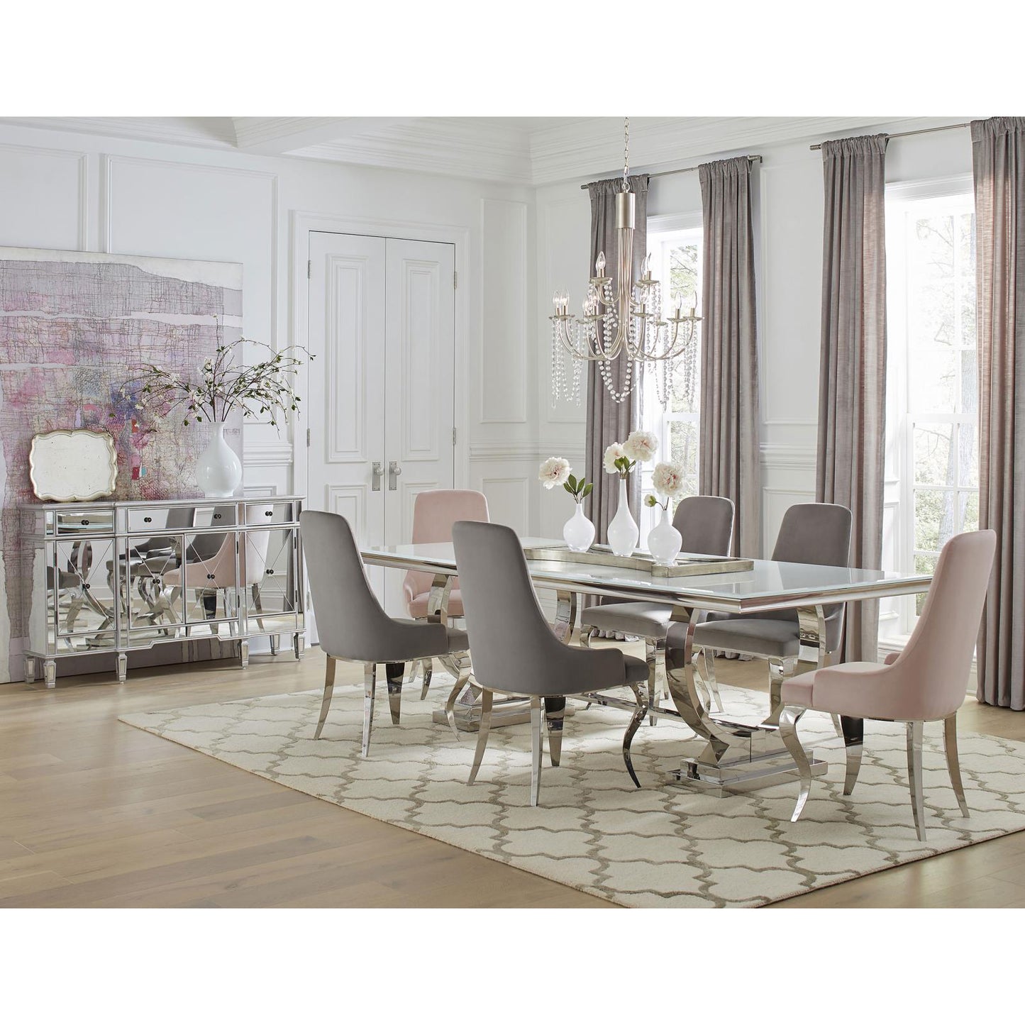 Modern dining table with mirrored buffet and upholstered chairs