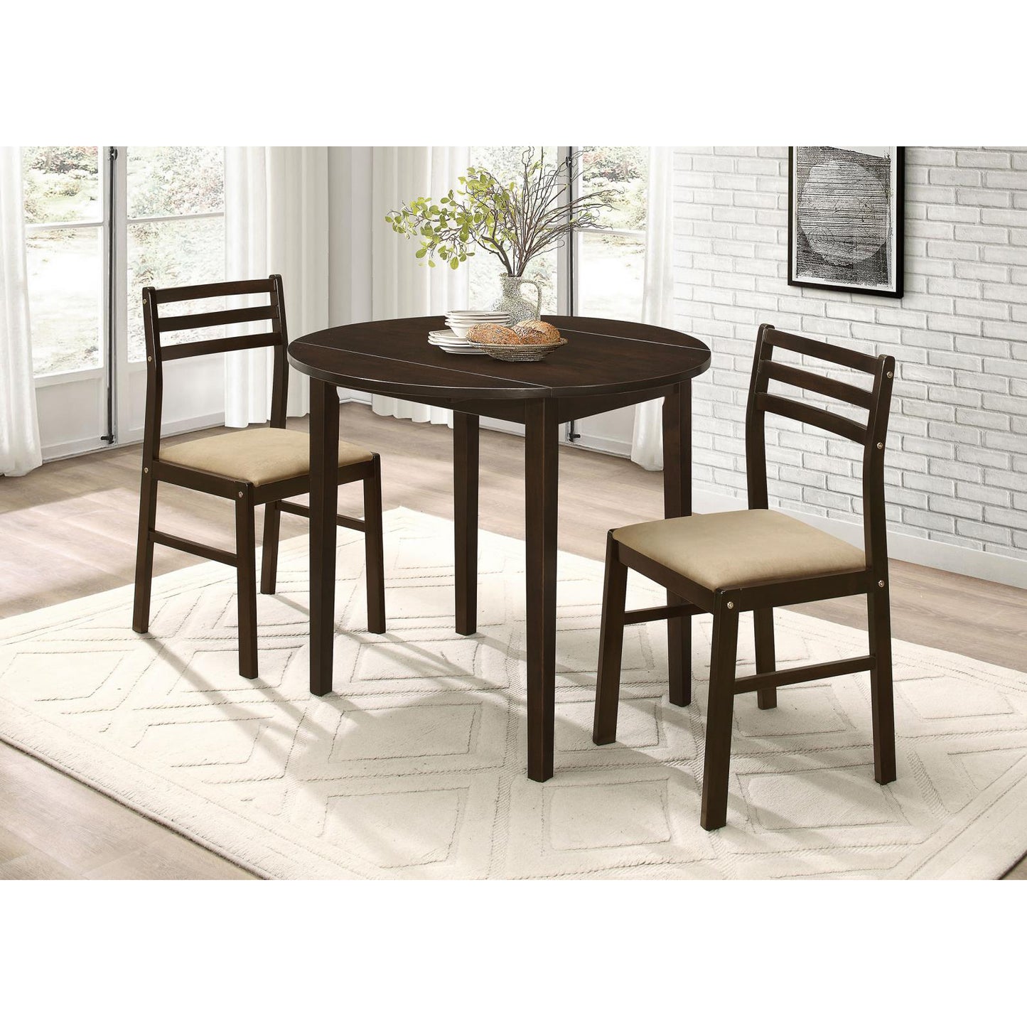 Dark wood round dining table with two upholstered chairs perfect for small spaces