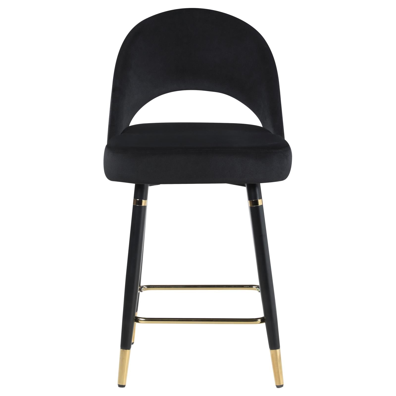 Black velvet bar stool with curved back and gold accents