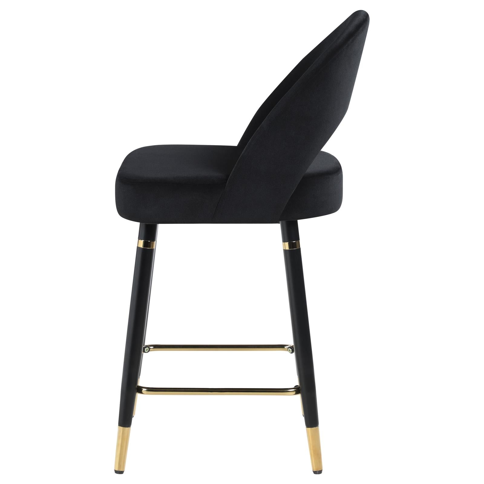 Black velvet bar stool with gold accents and curved back modern accent piece