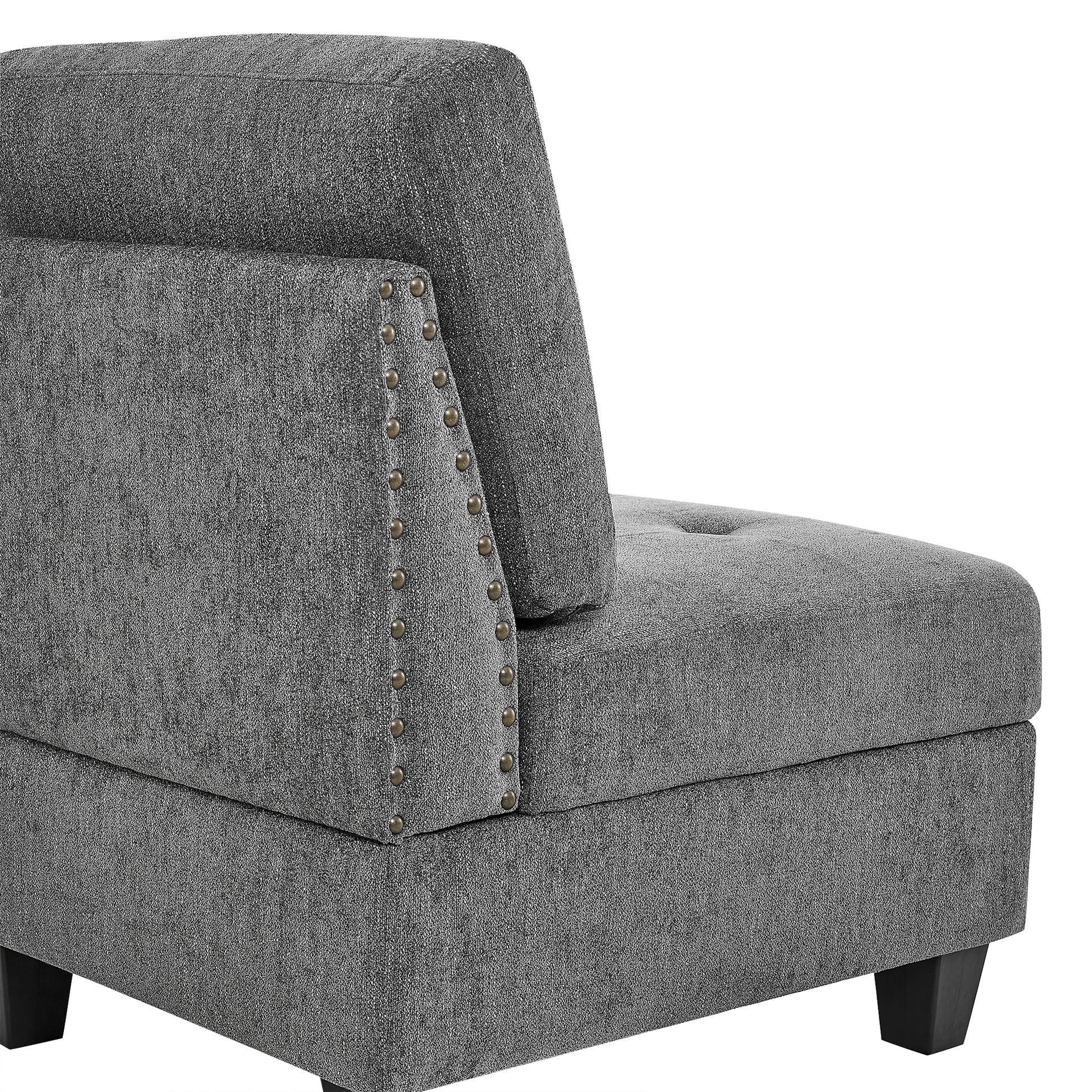 Grey fabric accent chair module with silver nailhead trim and button tufting detail