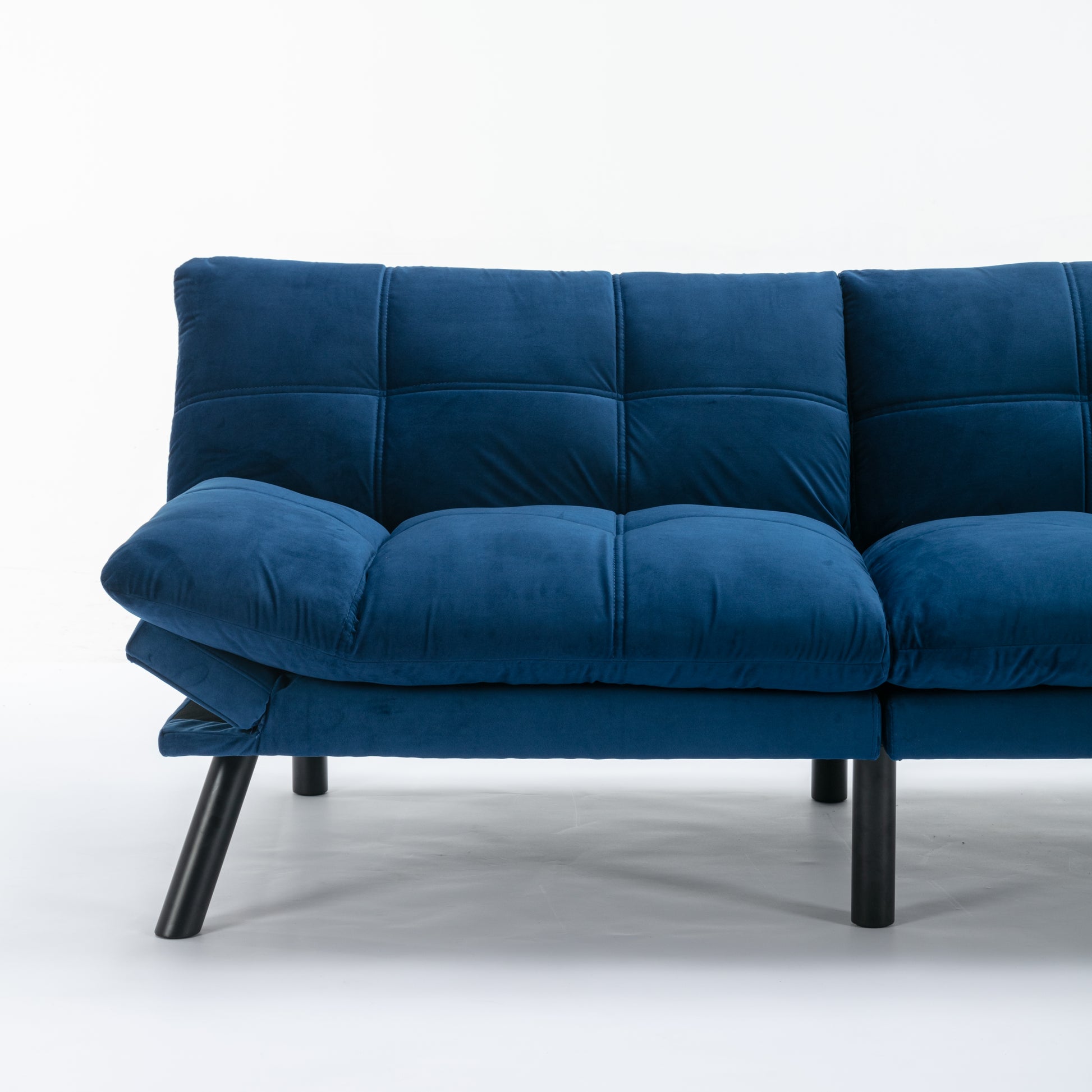 Navy blue velvet sofa with tufted seat and backrest on black legs