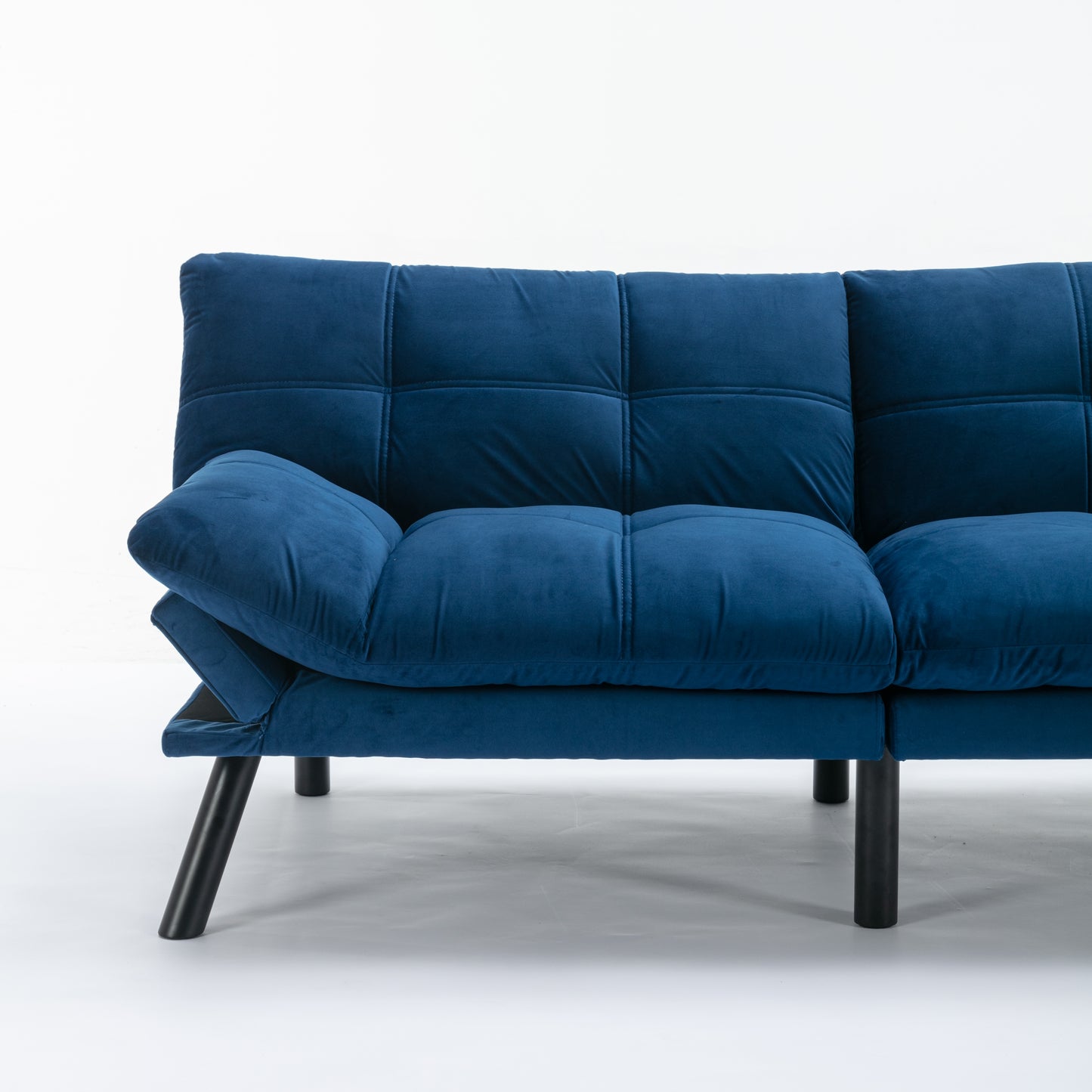 Tufted blue velvet sofa with modern black legs perfect for a living room