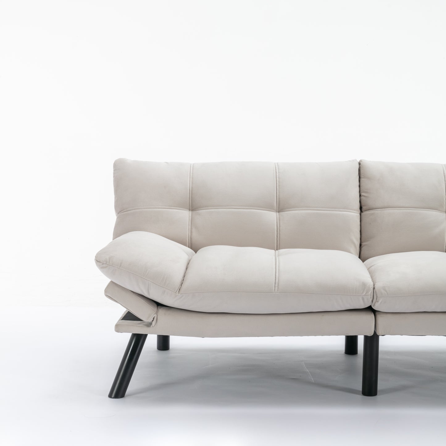 Modern beige velvet sofa with tufted cushions and black legs perfect for living room seating