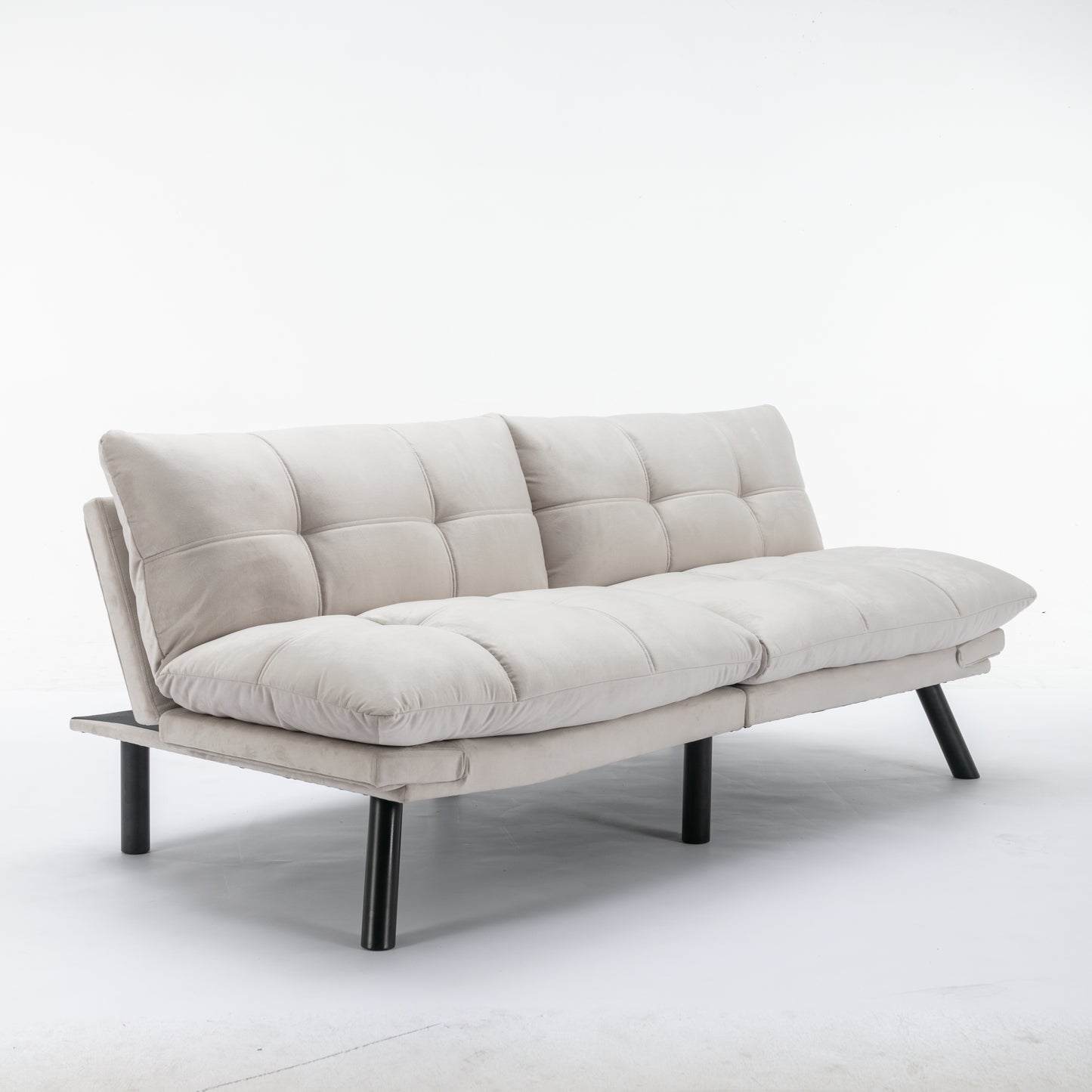 Tufted beige fabric futon sofa with black metal legs perfect for small apartments