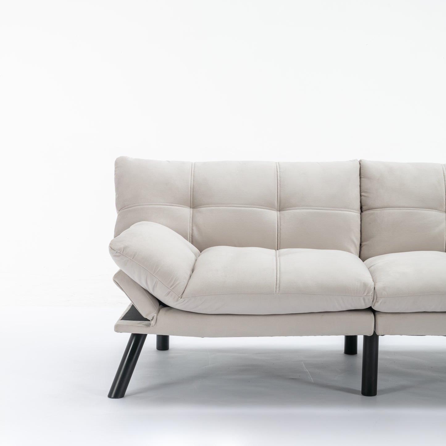 Beige upholstered sofa with tufted cushions and black metal legs modern minimalist design