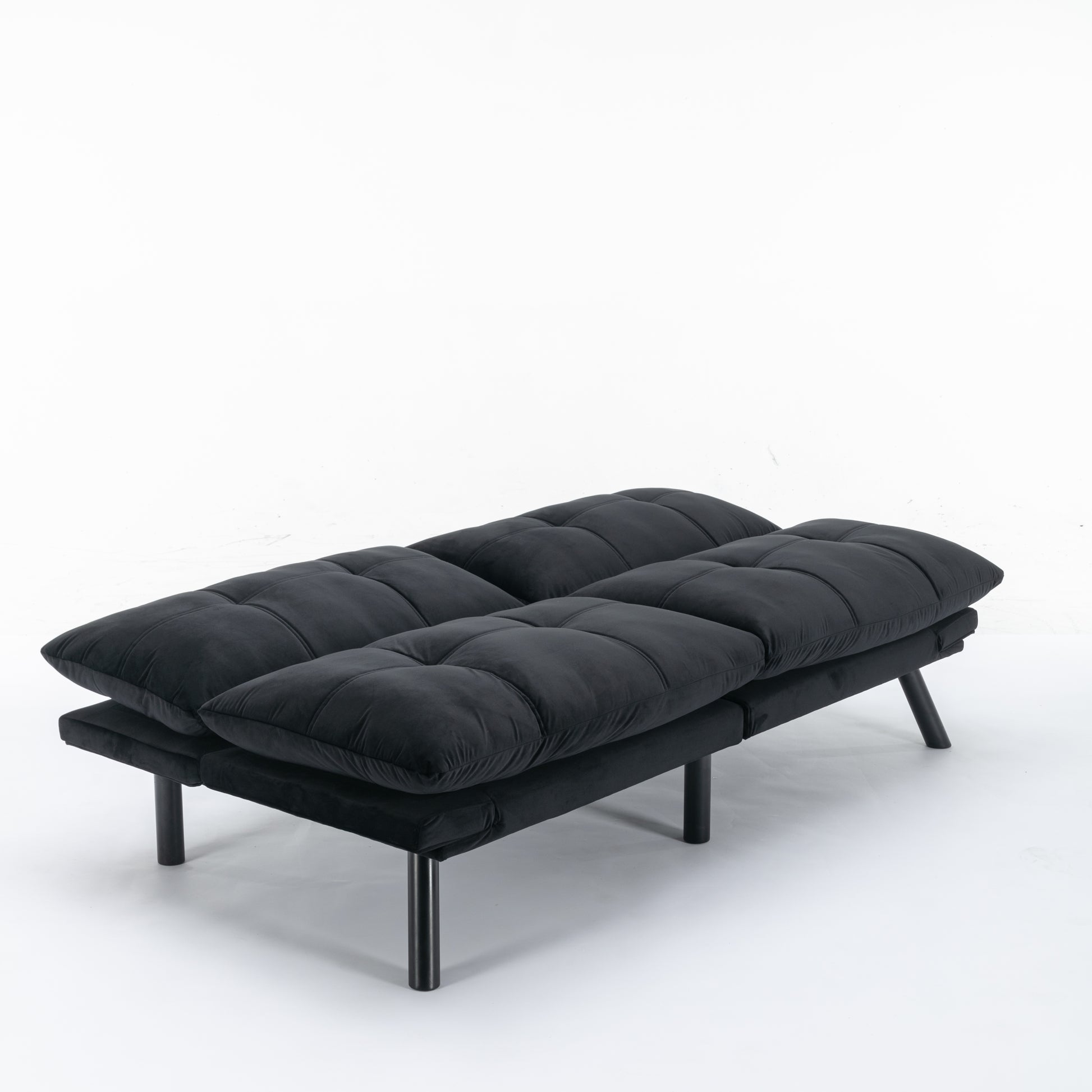 Black velvet futon sofa with tufted cushions and modern black legs