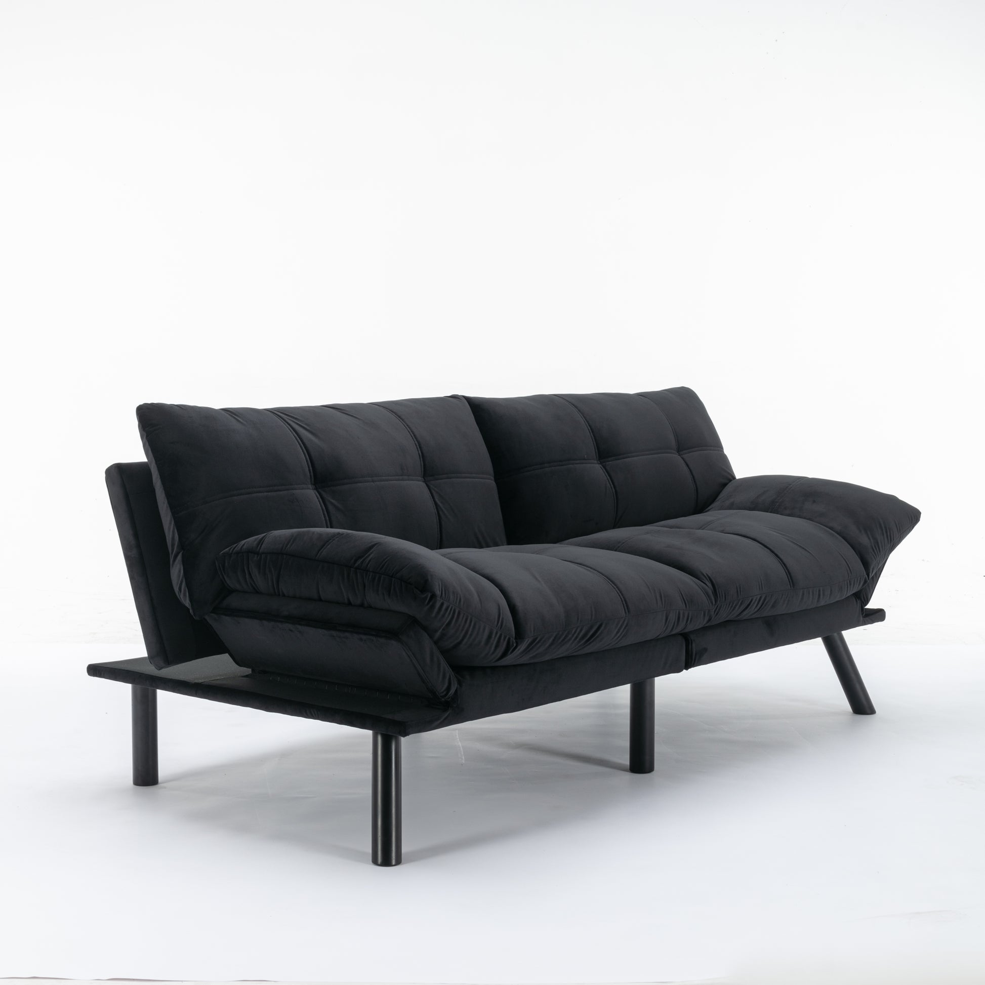 Black velvet sofa with plush cushions and modern black legs Perfect for small spaces